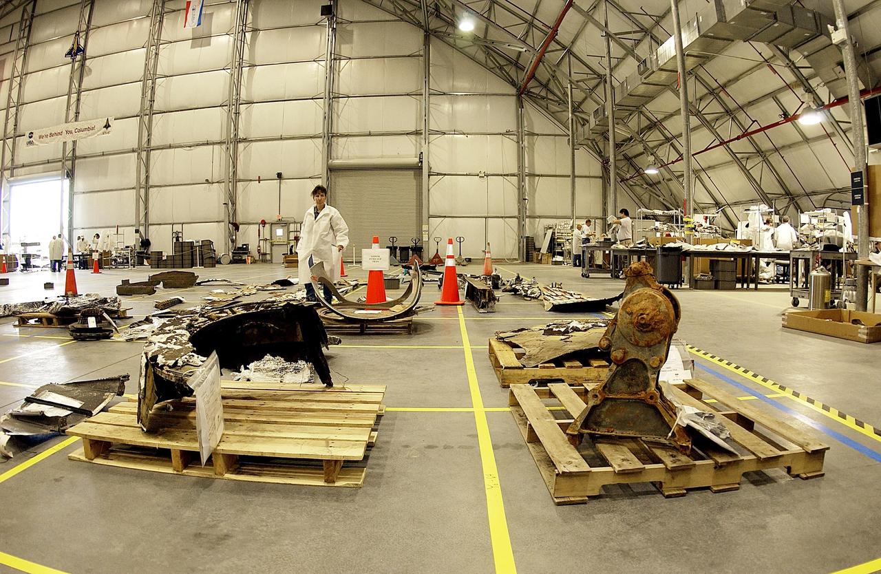 KENNEDY SPACE CENTER, FLA. -- The layout of the debris from the Space Shuttle Columbia is captured in this wide-angle view of a section of the RLV Hangar floor. The debris is being shipped to KSC from the collection point at Barksdale Air Force Base, Shreveport, La. As part of the ongoing investigation into the tragic accident that claimed Columbia and her crew of seven, workers will attempt to reconstruct the orbiter inside the hangar.