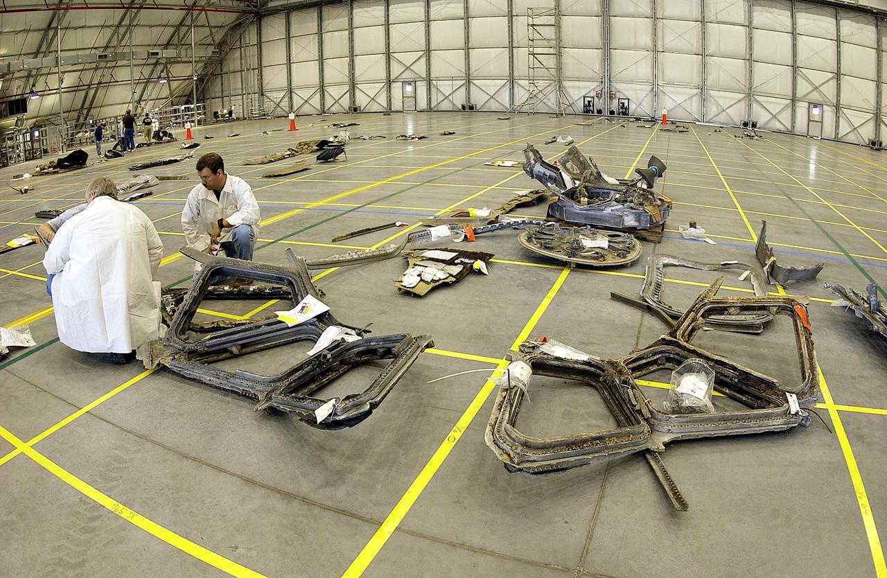 KENNEDY SPACE CENTER, FLA. -- The layout of the debris from the Space Shuttle Columbia is captured in this wide-angle view of a section of the RLV Hangar floor. The debris is being shipped to KSC from the collection point at Barksdale Air Force Base, Shreveport, La. As part of the ongoing investigation into the tragic accident that claimed Columbia and her crew of seven, workers will attempt to reconstruct the orbiter inside the hangar.