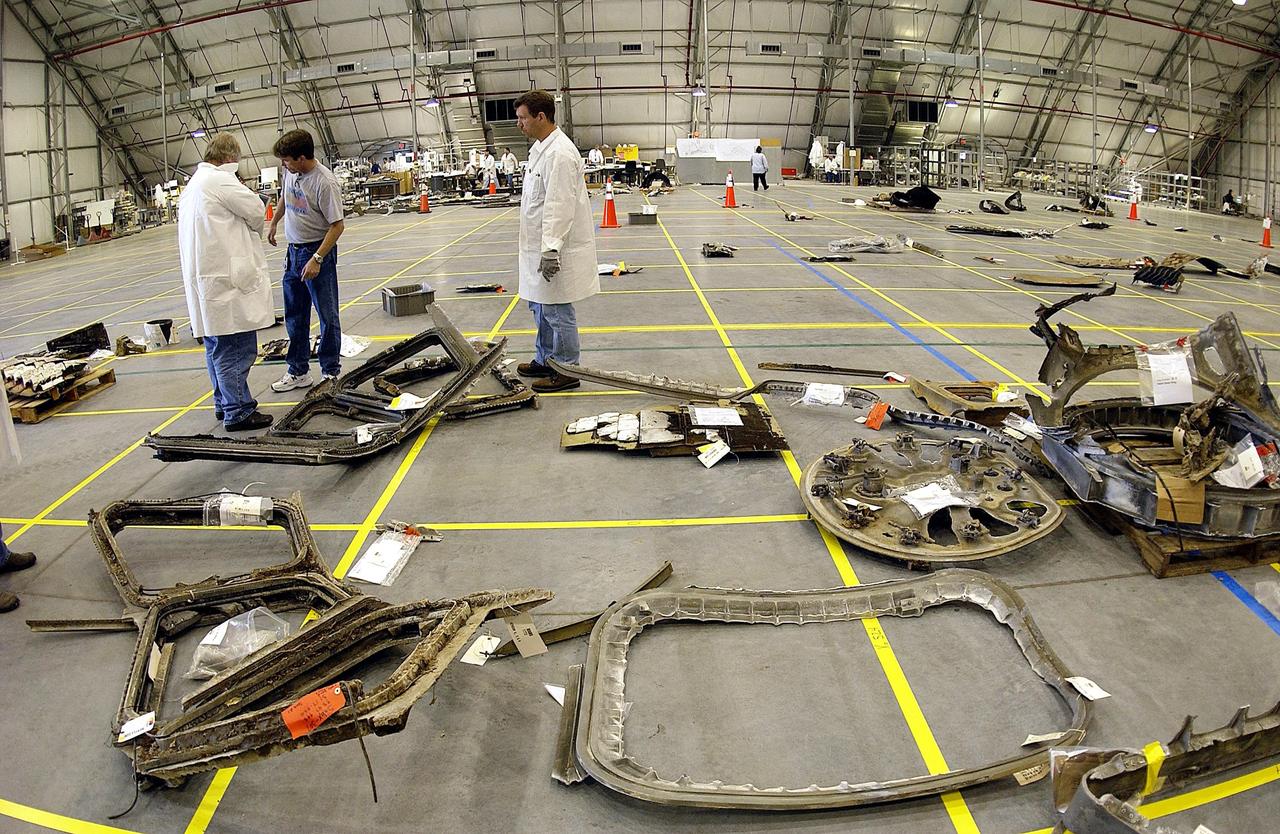 KENNEDY SPACE CENTER, FLA. -- The layout of the debris from the Space Shuttle Columbia is captured in this wide-angle view of a section of the RLV Hangar floor. The debris is being shipped to KSC from the collection point at Barksdale Air Force Base, Shreveport, La. As part of the ongoing investigation into the tragic accident that claimed Columbia and her crew of seven, workers will attempt to reconstruct the orbiter inside the hangar.