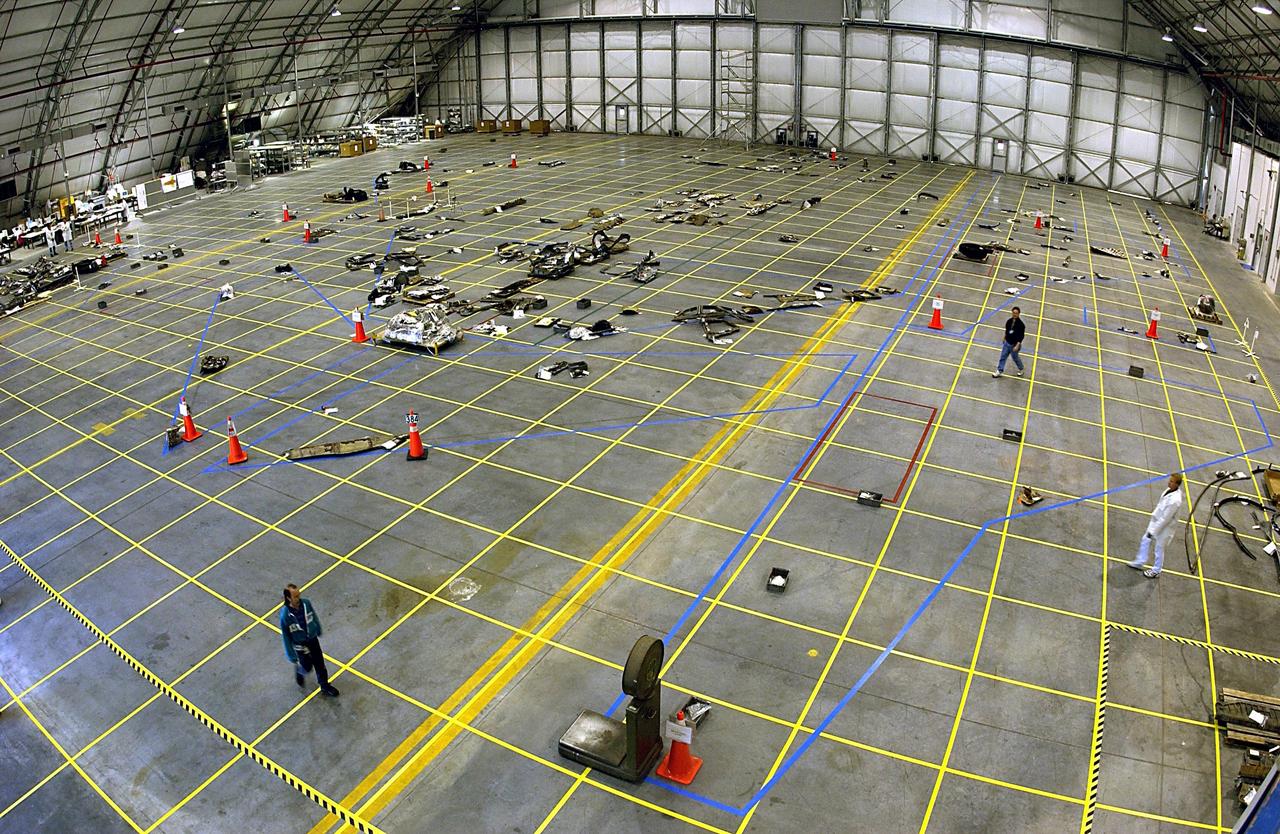 KENNEDY SPACE CENTER, FLA. -- The layout of the debris from the Space Shuttle Columbia received at KSC to date is captured in this aerial view of the RLV Hangar floor. Several shipments of the debris have been delivered to KSC from the collection point at Barksdale Air Force Base, Shreveport, La. As part of the ongoing investigation into the tragic accident that claimed Columbia and her crew of seven, workers will attempt to reconstruct the orbiter inside the hangar.