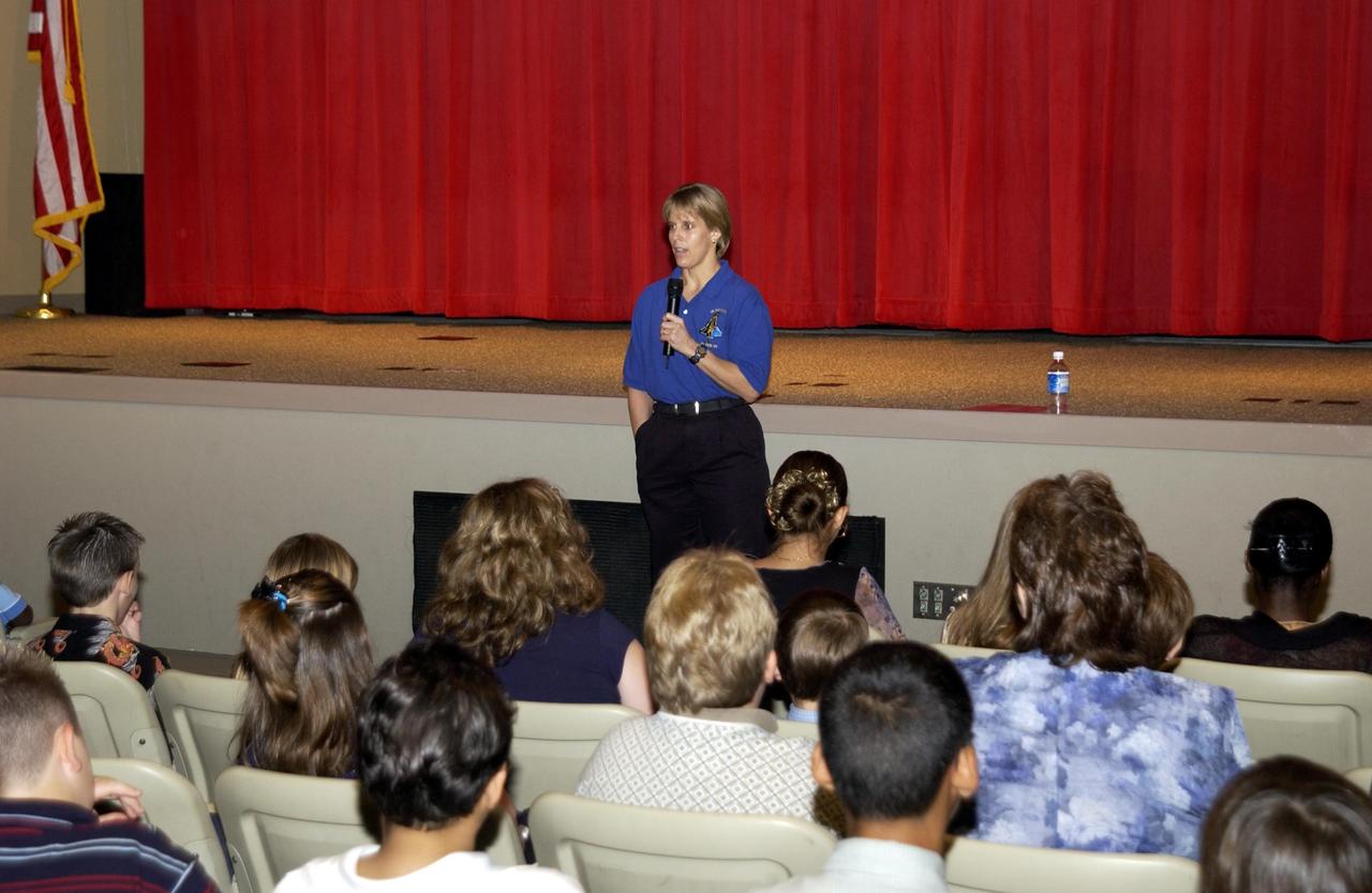 KENNEDY SPACE CENTER, FLA. - At the KSC Visitor Complex, Kirstie McCool Chadwick, the sister of astronaut William "Willie" J. McCool who perished in the Space Shuttle Columbia explosion Feb. 1, talks to students from Columbia Elementary School in Palm Bay, Fla.  The students visited the Center to learn about the past, present and future of space exploration.  They also visited the Astronaut Memorial, placing flowers and observing a moment of silence in honor of the fallen crew of Columbia, and saw the 3-D IMAX film "Space Station."