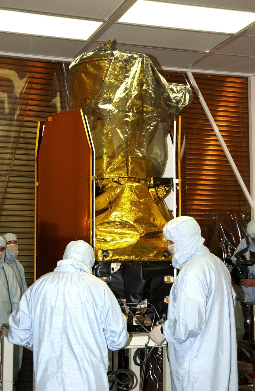 KENNEDY SPACE CENTER, FLA. -- In the Multi-Payload Processing Facility, the GALEX satellite has been moved to a rotation stand. The Galaxy Evolution Explorer (GALEX) is an orbiting space telescope that will observe galaxies in ultraviolet light across 10 billion years of cosmic history. Led by the California Institute of Technology, GALEX will conduct several first-of-a-kind sky surveys, including an extra-galactic (beyond our galaxy) ultraviolet all-sky survey. During its 29-month mission GALEX will produce the first comprehensive map of a Universe of galaxies under construction, bringing more understanding of how galaxies like the Milky Way were formed. GALEX is due to be launched from Cape Canaveral Air Force Station March 25 via a Pegasus rocket.