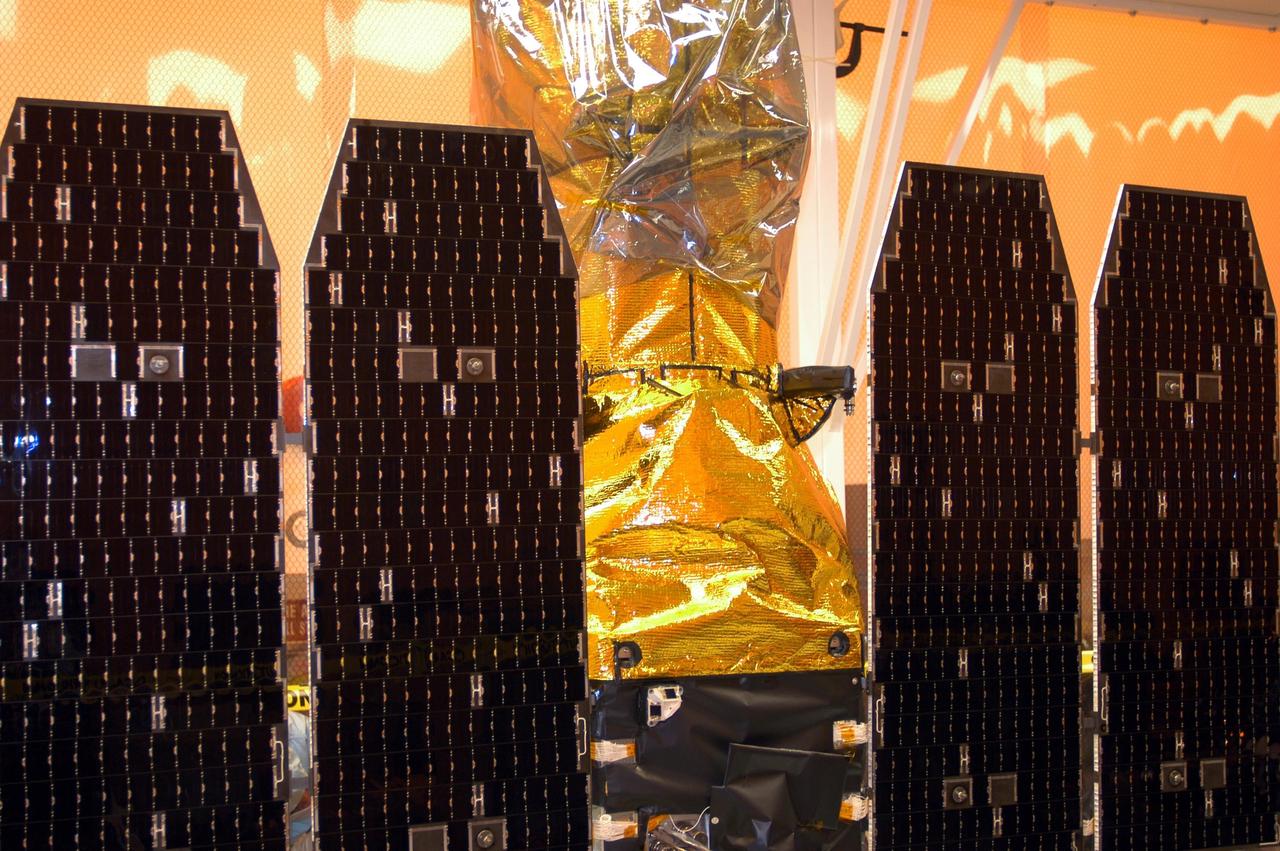 KENNEDY SPACE CENTER, FLA. -- The solar array panels on the Galaxy Evolution Explorer (GALEX) satellite are deployed during processing in the Multi-Payload Processing Facility. The GALEX is an orbiting space telescope that will observe galaxies in ultraviolet light across 10 billion years of cosmic history. Led by the California Institute of Technology, GALEX will conduct several first-of-a-kind sky surveys, including an extra-galactic (beyond our galaxy) ultraviolet all-sky survey. During its 29-month mission GALEX will produce the first comprehensive map of a Universe of galaxies under construction, bringing more understanding of how galaxies like the Milky Way were formed. GALEX is due to be launched from Cape Canaveral Air Force Station March 25 via a Pegasus rocket.