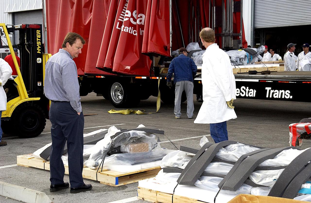 KENNEDY SPACE CENTER, FLA. --  Columbia debris continues to arrive at the RLV Hangar at KSC.  Workers are attempting to reconstruct the orbiter inside the hangar as part of the ongoing investigation into the tragic accident that claimed Columbia and her crew of seven returning from mission STS-107.