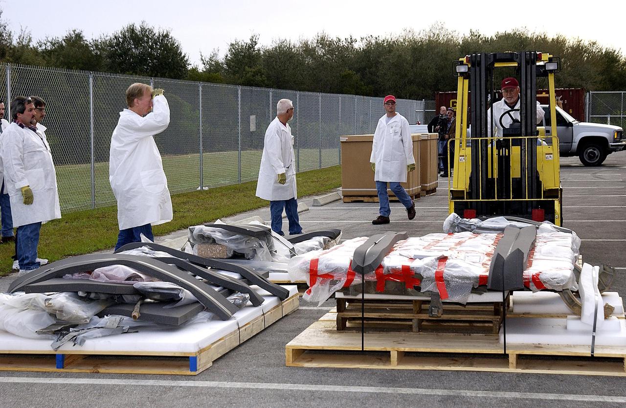 KENNEDY SPACE CENTER, FLA. -- Columbia debris continues to arrive at the RLV Hangar at KSC.  Workers are attempting to reconstruct the orbiter inside the hangar as part of the ongoing investigation into the tragic accident that claimed Columbia and her crew of seven returning from mission STS-107.        .