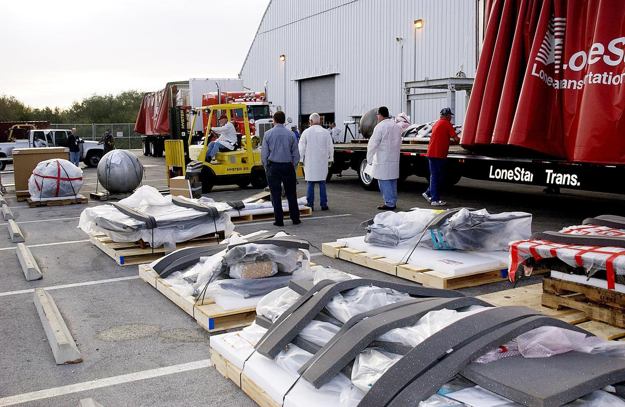 KENNEDY SPACE CENTER, FLA. -- Columbia debris continues to arrive at the RLV Hangar at KSC.  Workers are attempting to reconstruct the orbiter inside the hangar as part of the ongoing investigation into the tragic accident that claimed Columbia and her crew of seven returning from mission STS-107.          .
