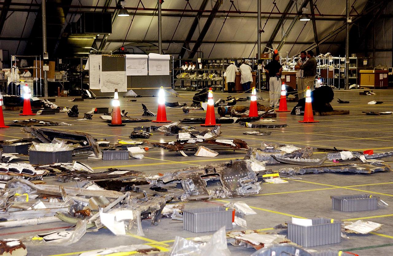 KENNEDY SPACE CENTER, FLA. - Columbia debris is spread across the grid in the RLV Hangar at KSC.  Workers are attempting to reconstruct the orbiter inside the hangar as part of the ongoing investigation into the tragic accident that claimed Columbia and her crew of seven returning from mission STS-107.           .