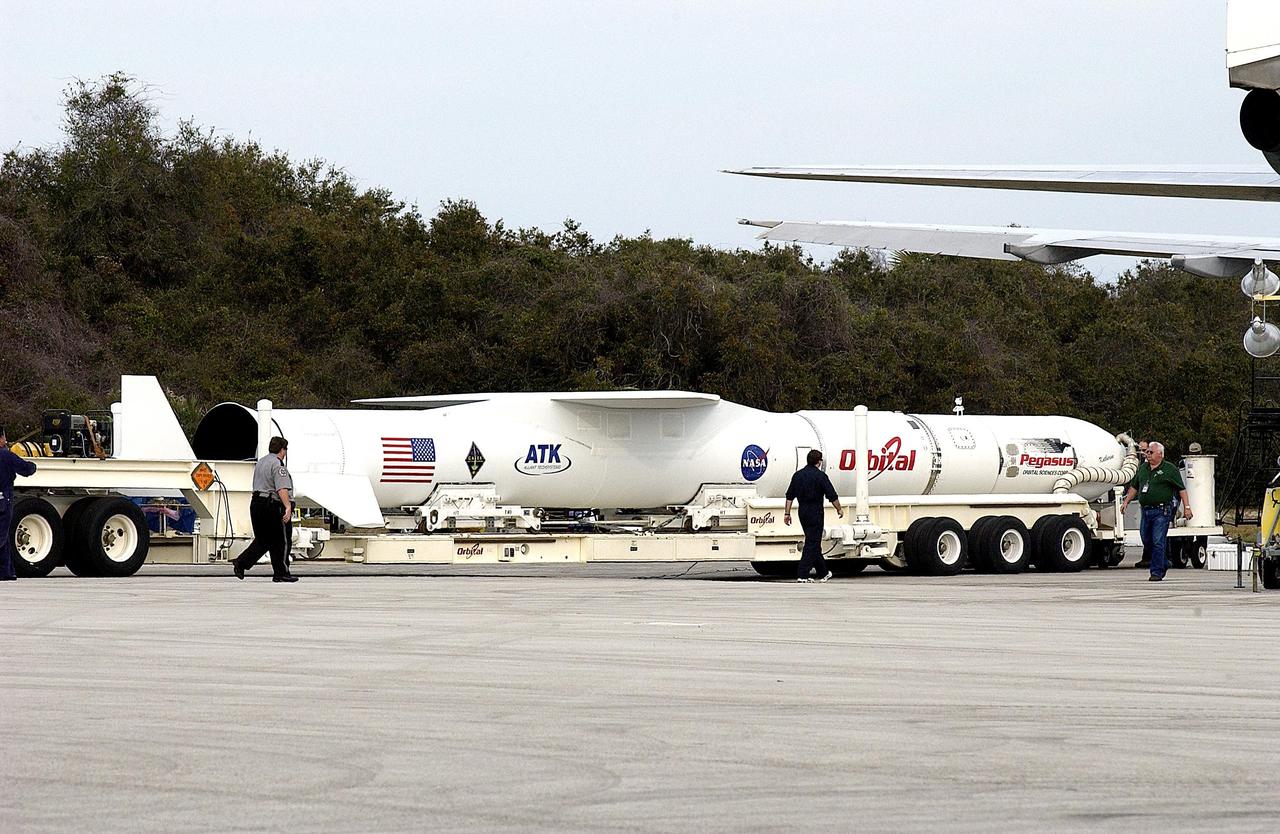 KENNEDY SPACE CENTER, FLA. -- The Pegasus launch vehicle is on a transporter, ready to be moved from the Skid Strip, Cape Canaveral Air Force Station, to the Multi-Payload Processing Facility (MPPF) at KSC. There it will be mated to the Galaxy Evolution Explorer (GALEX). The Pegasus will carry the GALEX, an orbiting space telescope that will observe galaxies in ultraviolet light across 10 billion years of cosmic history, into orbit. Led by the California Institute of Technology, GALEX will conduct several first-of-a-kind sky surveys, including an extra-galactic (beyond our galaxy) ultraviolet all-sky survey. During its 29-month mission GALEX will produce the first comprehensive map of a Universe of galaxies under construction, bringing more understanding of how galaxies like the Milky Way were formed. GALEX is due to be launched from Cape Canaveral Air Force Station March 25.