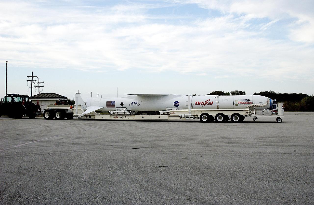 KENNEDY SPACE CENTER, FLA. -- The Pegasus launch vehicle is on a transporter, ready to be moved from the Skid Strip, Cape Canaveral Air Force Station, to the Multi-Payload Processing Facility (MPPF) at KSC. There it will be mated to the Galaxy Evolution Explorer (GALEX). The Pegasus will carry into orbit the GALEX, an orbiting space telescope that will observe galaxies in ultraviolet light across 10 billion years of cosmic history. Led by the California Institute of Technology, GALEX will conduct several first-of-a-kind sky surveys, including an extra-galactic (beyond our galaxy) ultraviolet all-sky survey. During its 29-month mission GALEX will produce the first comprehensive map of a Universe of galaxies under construction, bringing more understanding of how galaxies like the Milky Way were formed. GALEX is due to be launched from Cape Canaveral Air Force Station March 25.