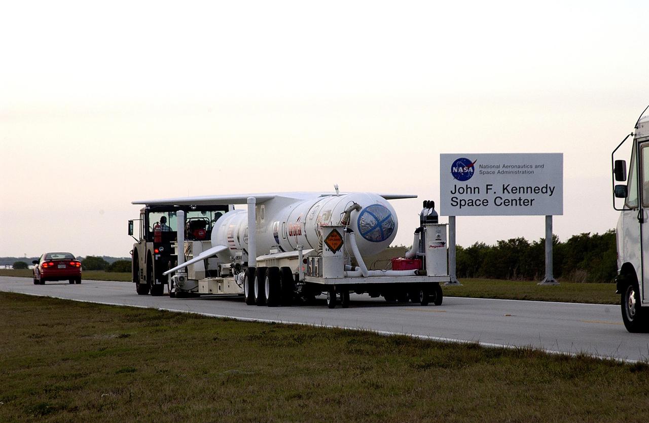 KENNEDY SPACE CENTER, FLA. -- The Pegasus launch vehicle is moved from the Skid Strip, Cape Canaveral Air Force Station, to the Multi-Payload Processing Facility (MPPF) at KSC. There it will be mated to the Galaxy Evolution Explorer (GALEX). The Pegasus will carry into orbit the GALEX, a space telescope that will observe galaxies in ultraviolet light across 10 billion years of cosmic history. Led by the California Institute of Technology, GALEX will conduct several first-of-a-kind sky surveys, including an extra-galactic (beyond our galaxy) ultraviolet all-sky survey. During its 29-month mission GALEX will produce the first comprehensive map of a Universe of galaxies under construction, bringing more understanding of how galaxies like the Milky Way were formed.  GALEX is due to be launched from Cape Canaveral Air Force Station March 25.