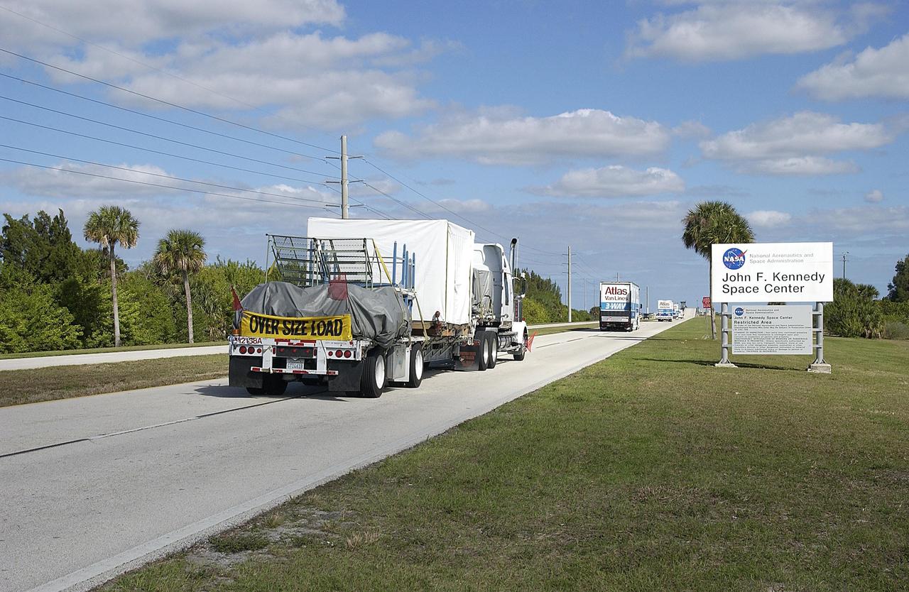 KENNEDY SPACE CENTER, FLA. -- The cruise stage, aeroshell and lander for the Mars Exploration Rover-1 mission and the MER-2 rover arrive at KSC. The same flight hardware for the MER-2 rover arrived Jan. 27; however, the MER-2 rover is scheduled to arrive at KSC in March. While at KSC, each of the two rovers, the aeroshells and the landers will undergo a full mission simulation. All of these flight elements will then be integrated together. After spin balance testing, each spacecraft will be mated to a solid propellant upper stage booster that will propel the spacecraft out of Earth orbit. Approximately 10 days before launch they will be transported to the launch pad for mating with their respective Boeing Delta II rockets. The rovers will serve as robotic geologists to seek answers about the evolution of Mars, particularly for a history of water. The rovers will be identical to each other, but will land at different regions of Mars. Launch of the MER-1 is scheduled for May 30. MER-2 will follow June 25.