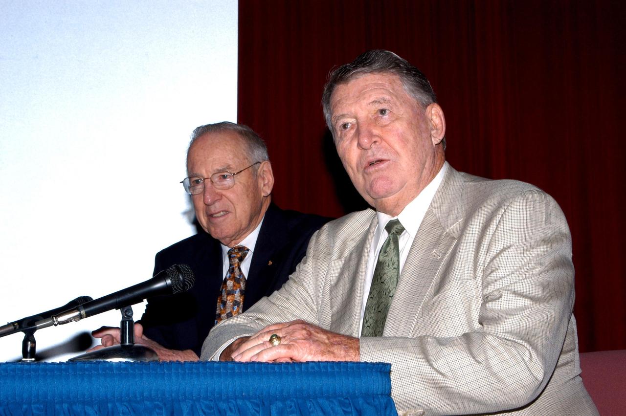 KENNEDY SPACE CENTER, FLA. -  During a presentation to KSC employees, former astronauts Jim Lovell (left) and Wally Schirra (right) answer questions from the audience. Lovell and Schirra visited KSC to talk about the space program and their experiences, as well as offer encouragement to workers to help get the space program "back on its feet."  They visited several sites around the Center, including the RLV Hangar where Columbia debris is being collected and examined as part of the investigation into the tragedy that claimed the orbiter and lives of seven astronauts returning from mission STS-107.