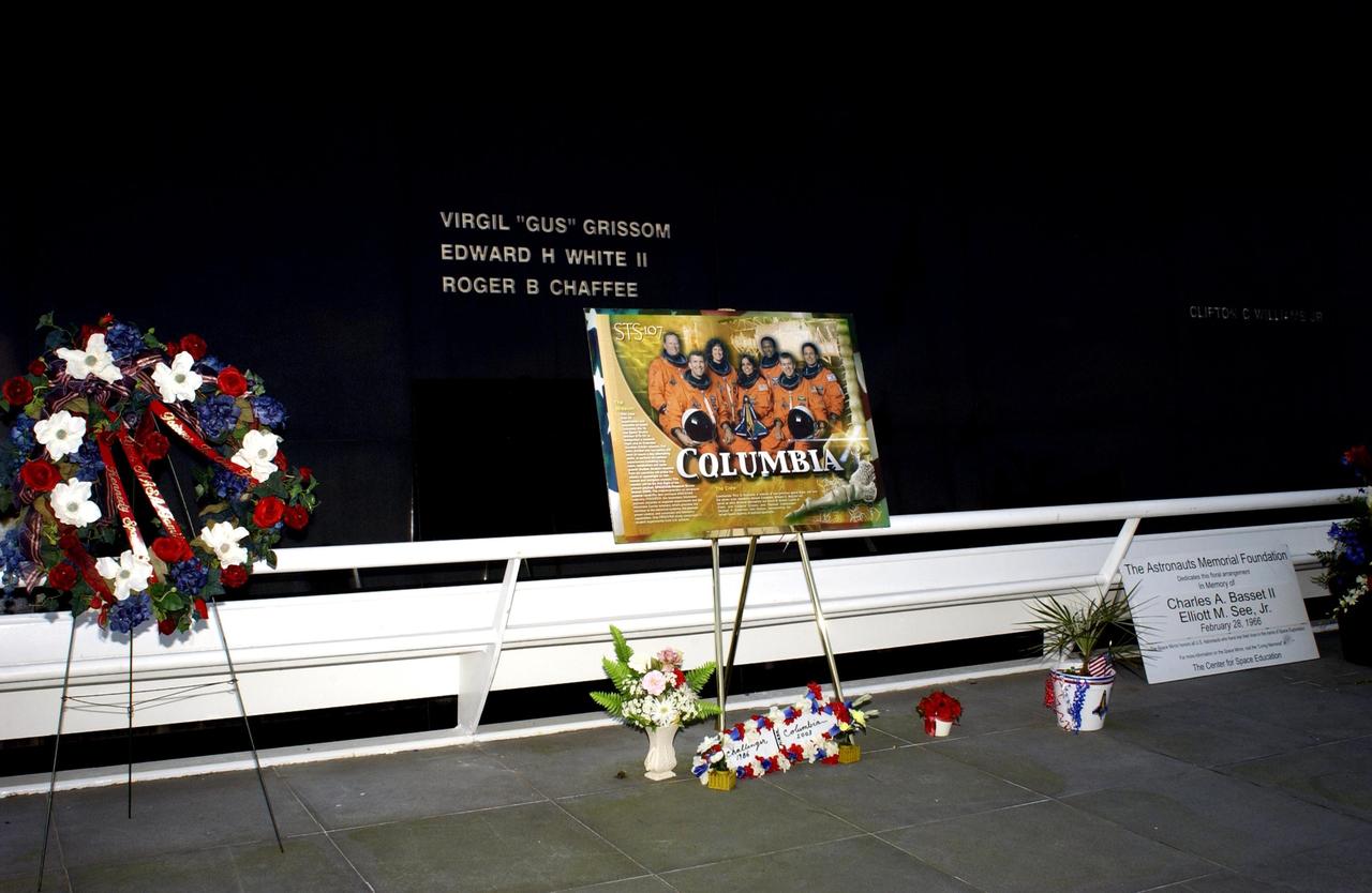 KENNEDY SPACE CENTER, FLA. -  A tribute to the fallen crew of the Columbia tragedy rests below the Astronaut Memorial Space Mirror at the KSC Visitor Complex.  The crew were lost in an explosion Feb. 1, 2003, as they were returning to Earth from mission STS-107.  The tribute links to the loss of Challenger and her crew in 1986.  The Space Mirror is a national tribute to 17 American astronauts who previously gave their lives to the quest to explore space.