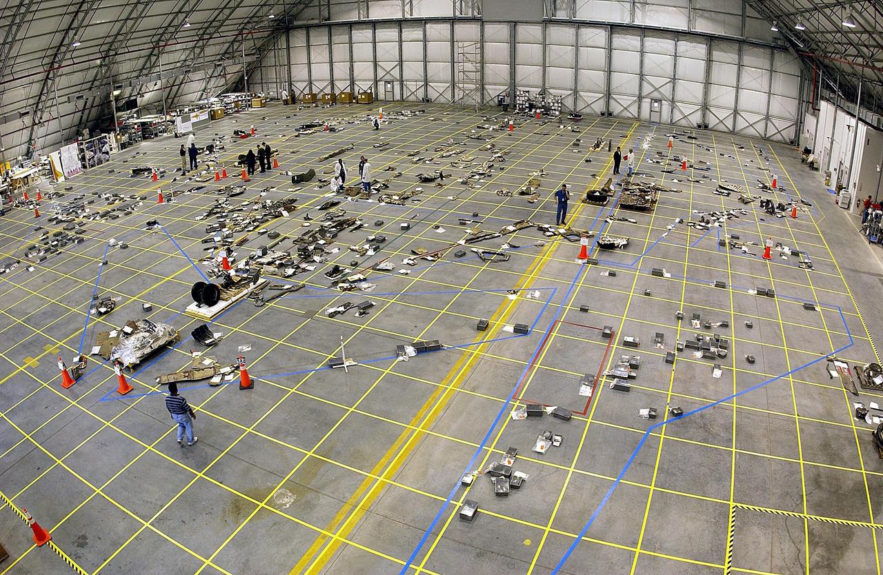 KENNEDY SPACE CENTER, FLA. -- In the RLV Hangar, the floor grid is marked with a growing number of pieces of Columbia debris.   The Columbia Reconstruction Project Team will attempt to reconstruct the orbiter as part of the investigation into the accident that caused the destruction of Columbia and loss of its crew as it returned to Earth on mission STS-107.