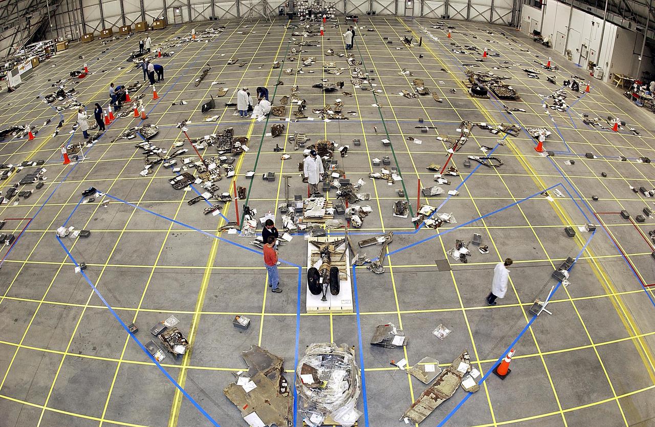 KENNEDY SPACE CENTER, FLA. - A fish-eye view in the RLV Hangar shows the growing number of pieces of Columbia debris shipped from Barksdale AFB, Shreveport, La.  Barksdale continues to be the receiving and shipping point for Columbia materials being sent to KSC for final identification.   The Columbia Reconstruction Project Team is attempting to reconstruct the orbiter as part of the investigation into the accident that caused the destruction of Columbia and loss of its crew as it returned to Earth on mission STS-107.