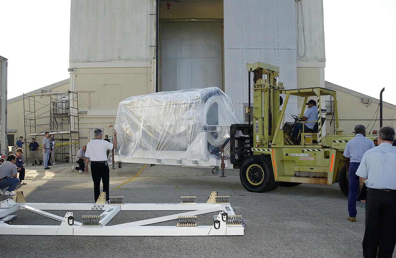 The Space Infrared Telescope Facility (SIRTF) arrived at Building AE today to begin final preparations for its launch aboard a Delta II rocket. The observatory was shipped to Florida from the Lockheed Martin plant in Sunnyvale, Calif. SIRTF will obtain images and spectra by detecting the infrared energy, or heat, radiated by objects in space between wavelengths of 3 and 180 microns (1 micron is one-millionth of a meter). Most of this infrared radiation is blocked by the Earth's atmosphere and cannot be observed from the ground. Consisting of an 0.85-meter telescope and three cryogenically cooled science instruments, SIRTF is one of NASA's largest infrared telescopes to be launched. Its highly sensitive instruments will give a unique view of the Universe and peer into regions of space that are hidden from optical telescopes on the ground or orbiting telescopes such as the Hubble Space Telescope. SIRTF is scheduled for launch April 15 at 4:34:07 a.m. EDT from Launch Complex 17-B, Cape Canaveral Air Force Station.