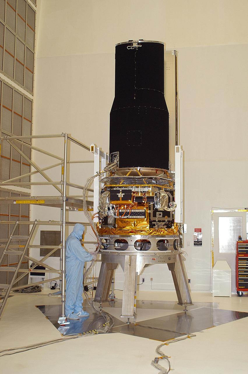 KENNEDY SPACE CENTER, FLA. -- At Building AE, the Space Infrared Telescope Facility (SIRTF) is unpacked after being shipped from the Lockheed Martin plant in Sunnyvale, Calif. SIRTF will obtain images and spectra by detecting the infrared energy, or heat, radiated by objects in space. Most of this infrared radiation is blocked by the Earth's atmosphere and cannot be observed from the ground. Consisting of an 0.85-meter telescope and three cryogenically cooled science instruments, SIRTF is one of NASA's largest infrared telescopes to be launched. SIRTF is scheduled for launch aboard a Delta II rocket from Launch Complex 17-B, Cape Canaveral Air Force Station.