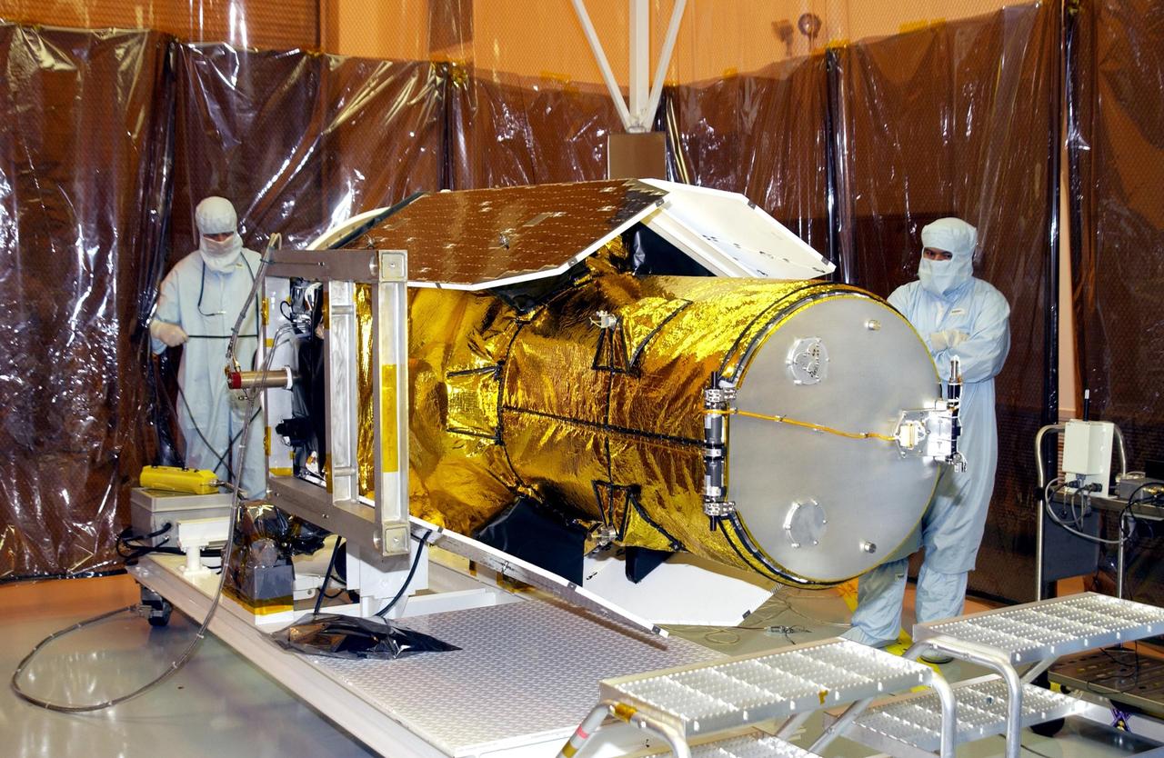 KENNEDY SPACE CENTER, FLA. -- NASA's Galaxy Evolution Explorer spacecraft is successfully rotated to horizontal in preparation for mating with the Pegasus XL launch vehicle. The GALEX, set to launch April 2 from Cape Canaveral Air Force Station, will carry into space an orbiting telescope that will observe a million galaxies across 10 billion years of cosmic history to help astronomers determine when the stars and elements we see today had their origins. From its orbit high above Earth, the spacecraft will sweep the skies for 28 months using state-of-the-art ultraviolet detectors.  Looking in the ultraviolet will single out galaxies dominated by young, hot, short-lived stars that give off a great deal of energy at that wavelength.  These galaxies are actively creating stars, and therefore provide a window into the history and causes of star formation in galaxies.