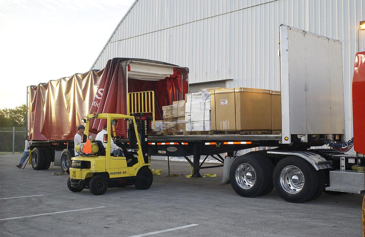 Another shipment of Columbia debris arrives at the KSC RLV Hangar. Inside, the Columbia Reconstruction Project Team is identifying pieces and placing them on a floor grid in a configuration of the orbiter. The team will attempt to reconstruct the orbiter as part of the investigation into the accident that caused the destruction of Columbia and loss of its crew as it returned to Earth on mission STS-107.