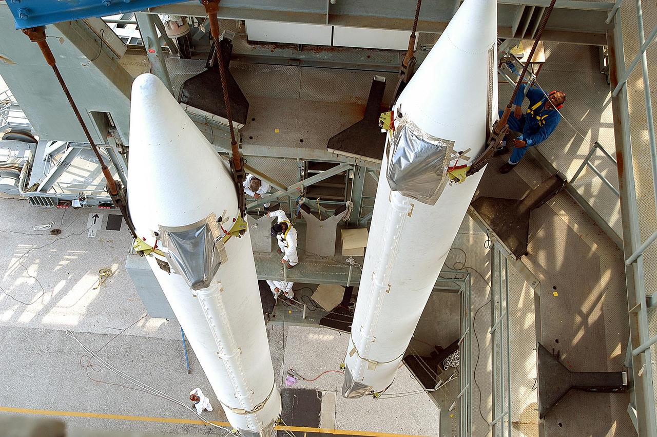 KENNEDY SPACE CENTER, FLA. --  This view looks down on two of the nine solid rocket boosters that will be mated with the Delta II rocket on Launch Complex 17-B, Cape Canaveral Air Force Station. The Delta II will launch the Space Infrared Telescope Facility. The second stage will later be hoisted atop the first stage.  SIRTF will obtain images and spectra by detecting the infrared energy, or heat, radiated by objects in space. Most of this infrared radiation is blocked by the Earth's atmosphere and cannot be observed from the ground. Consisting of an 0.85-meter telescope and three cryogenically cooled science instruments, SIRTF is one of NASA's largest infrared telescopes to be launched.
