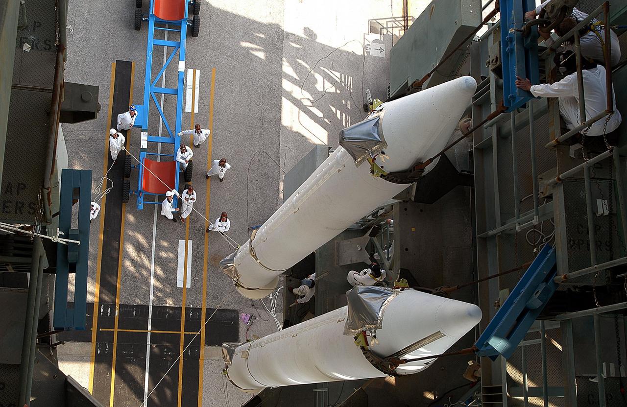 KENNEDY SPACE CENTER, FLA. -- This view looks down on two of the nine solid rocket boosters that will be mated with the Delta II rocket on Launch Complex 17-B, Cape Canaveral Air Force Station. The Delta II will launch the Space Infrared Telescope Facility. The second stage will later be hoisted atop the first stage.  SIRTF will obtain images and spectra by detecting the infrared energy, or heat, radiated by objects in space. Most of this infrared radiation is blocked by the Earth's atmosphere and cannot be observed from the ground. Consisting of an 0.85-meter telescope and three cryogenically cooled science instruments, SIRTF is one of NASA's largest infrared telescopes to be launched.