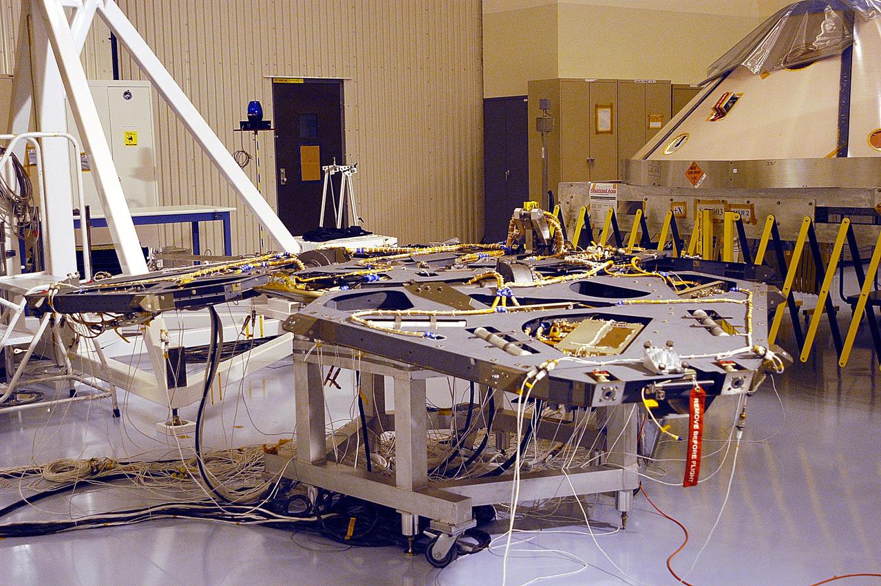 KENNEDY SPACE CENTER, Fla. - This view in the Payload Hazardous Servicing Facility shows one of the Mars Exploration Rover landers with its three side petals extended.  The rover will sit inside of the enclosed petals for its voyage and landing on Mars.  The two rovers, MER-1 and MER-2, their aeroshells and landers will undergo a full mission simulation before being integrated. After spin balance testing,  each spacecraft will be mated to a solid propellant upper stage booster that will propel the spacecraft out of Earth orbit. Approximately 10 days before launch they will be transported to the launch pad for mating with their respective Boeing Delta II rockets. The rovers will serve as robotic geologists to seek answers about the evolution of Mars, particularly  for a history of water. The rovers are identical to each other, but will land at different regions of Mars.  Launch of the first rover is scheduled for May 30 from Cape Canaveral Air Force Station.  The second will follow June 25.