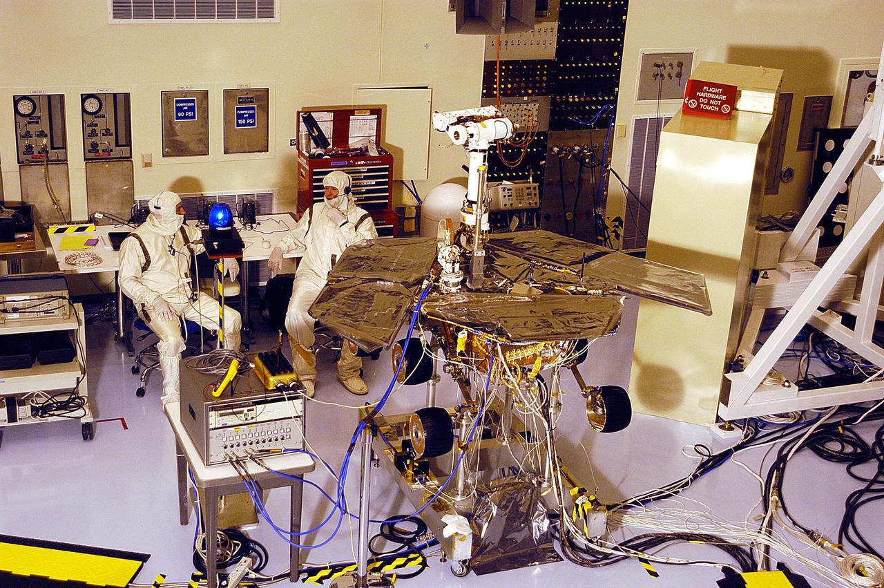 KENNEDY SPACE CENTER, Fla. -  In the Payload Hazardous Servicing Facility, one of the two Mars Exploration Rovers, MER-2, undergoes testing.  MER-1 and MER-2, their aeroshells and landers will undergo a full mission simulation before being integrated. After spin balance testing,  each spacecraft will be mated to a solid propellant upper stage booster that will propel the spacecraft out of Earth orbit. Approximately 10 days before launch they will be transported to the launch pad for mating with their respective Boeing Delta II rockets. The rovers will serve as robotic geologists to seek answers about the evolution of Mars, particularly  for a history of water. The rovers are identical to each other, but will land at different regions of Mars.  Launch of the first rover is scheduled for May 30 from Cape Canaveral Air Force Station.  The second will follow June 25.
