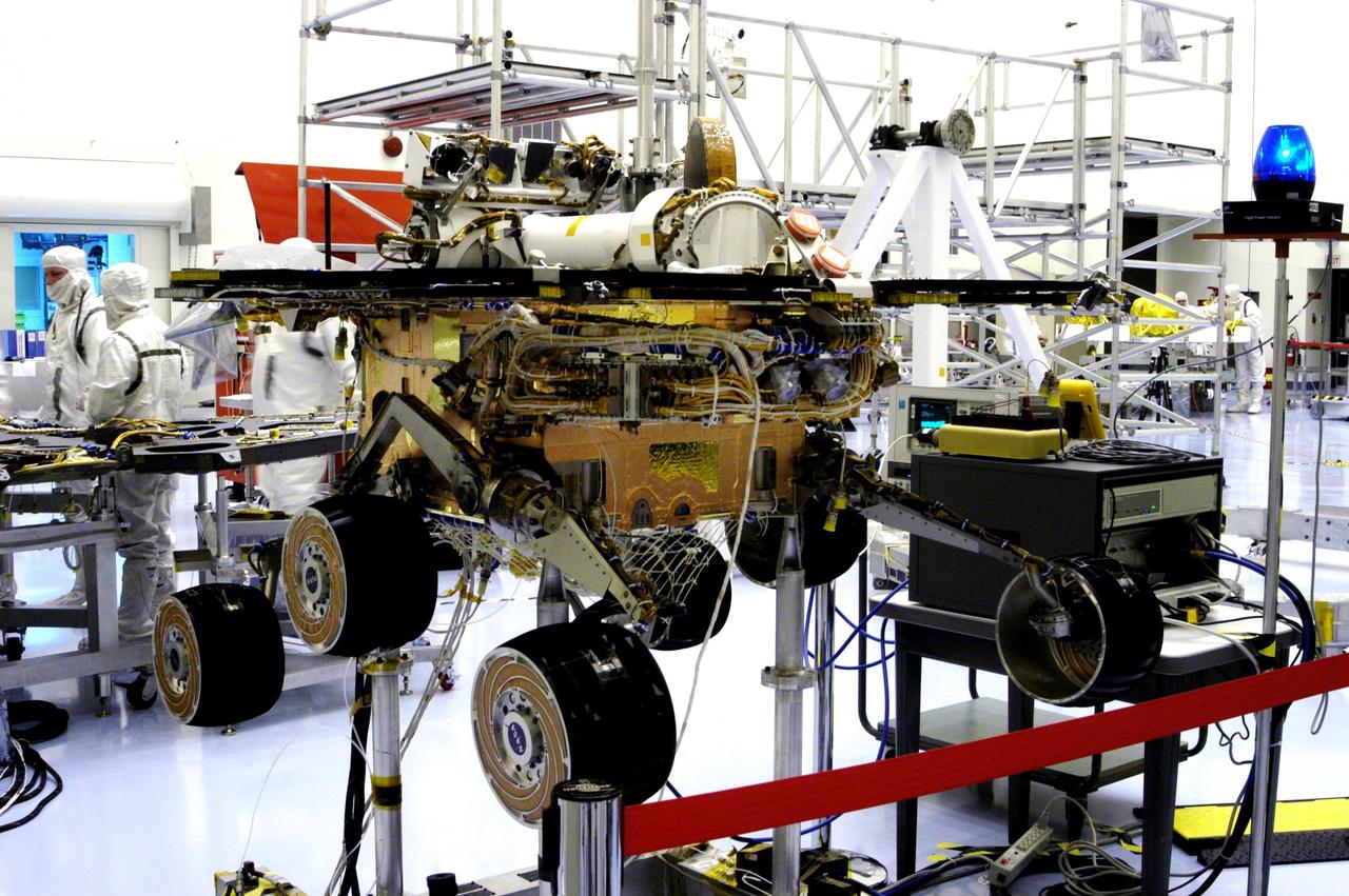 KENNEDY SPACE CENTER, FLA. - The Mars Exploration Rover 2 (MER-2) undergoes testing in the Payload Hazardous Servicing Facility.   MER-1 and MER-2, their aeroshells and landers will undergo a full mission simulation before being integrated. After spin balance testing,  each spacecraft will be mated to a solid propellant upper stage booster that will propel the spacecraft out of Earth orbit. Approximately 10 days before launch they will be transported to the launch pad for mating with their respective Boeing Delta II rockets. The rovers will serve as robotic geologists to seek answers about the evolution of Mars, particularly  for a history of water. The rovers are identical to each other, but will land at different regions of Mars.  Launch of the first rover is scheduled for May 30 from Cape Canaveral Air Force Station.  The second will follow June 25.