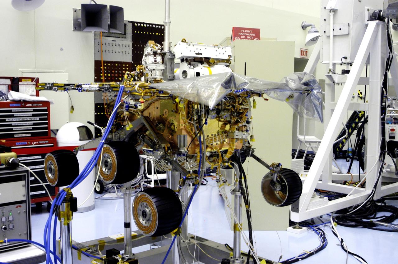 KENNEDY SPACE CENTER, Fla. - The Mars Exploration Rover 2 (MER-2) undergoes testing in the Payload Hazardous Servicing Facility.   MER-1 and MER-2, their aeroshells and landers will undergo a full mission simulation before being integrated. After spin balance testing,  each spacecraft will be mated to a solid propellant upper stage booster that will propel the spacecraft out of Earth orbit. Approximately 10 days before launch they will be transported to the launch pad for mating with their respective Boeing Delta II rockets. The rovers will serve as robotic geologists to seek answers about the evolution of Mars, particularly  for a history of water. The rovers are identical to each other, but will land at different regions of Mars.  Launch of the first rover is scheduled for May 30 from Cape Canaveral Air Force Station.  The second will follow June 25.