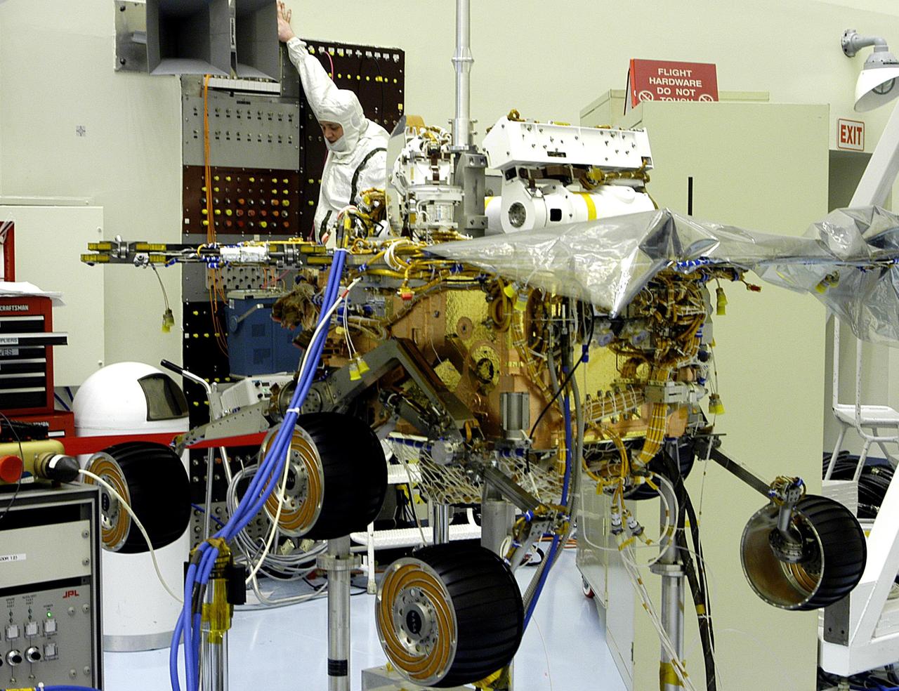 KENNEDY SPACE CENTER, Fla. - The Mars Exploration Rover 2 (MER-2) undergoes testing in the Payload Hazardous Servicing Facility.   MER-1 and MER-2, their aeroshells and landers will undergo a full mission simulation before being integrated. After spin balance testing,  each spacecraft will be mated to a solid propellant upper stage booster that will propel the spacecraft out of Earth orbit. Approximately 10 days before launch they will be transported to the launch pad for mating with their respective Boeing Delta II rockets. The rovers will serve as robotic geologists to seek answers about the evolution of Mars, particularly  for a history of water. The rovers are identical to each other, but will land at different regions of Mars.  Launch of the first rover is scheduled for May 30 from Cape Canaveral Air Force Station.  The second will follow June 25.