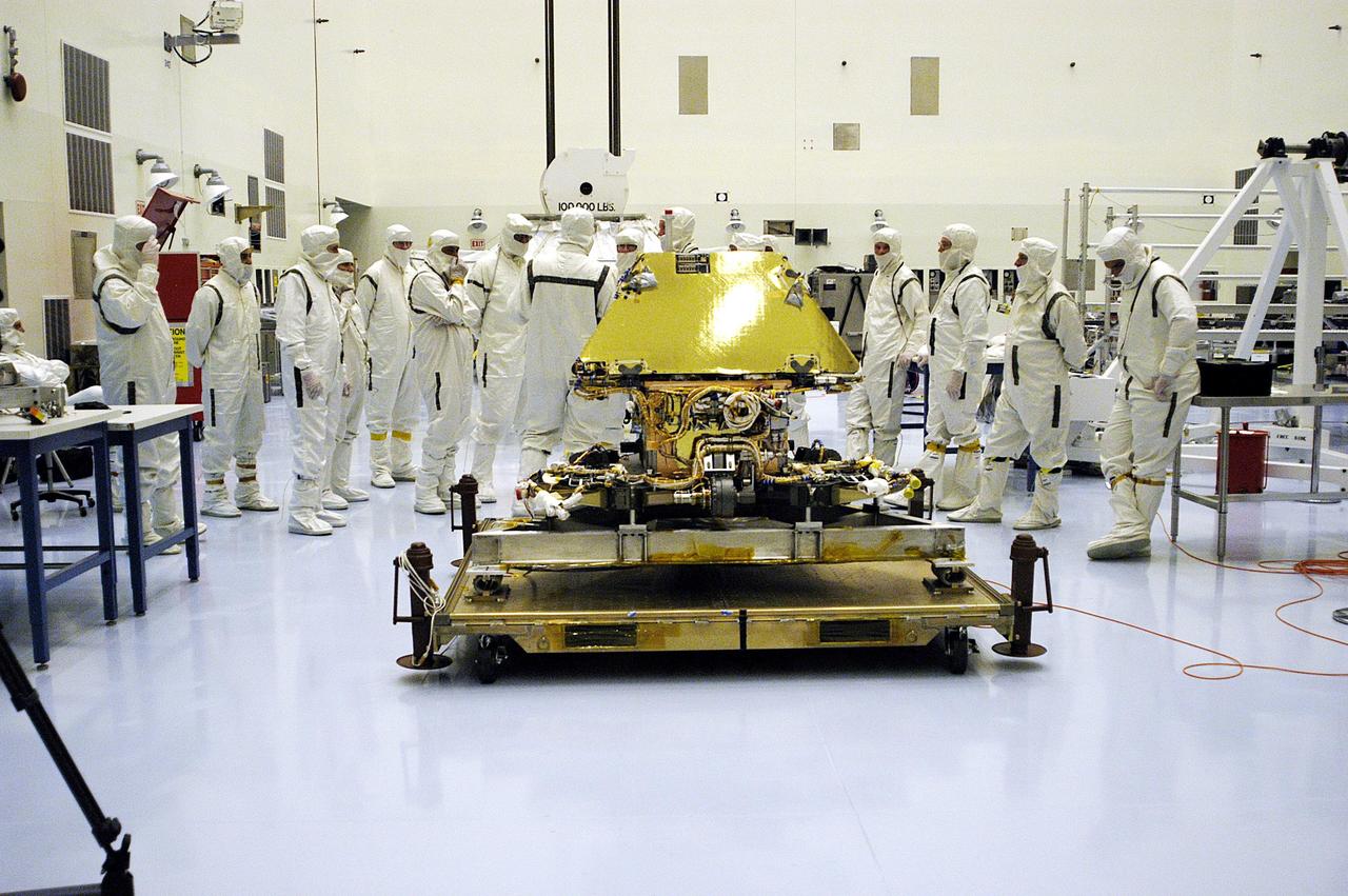 KENNEDY SPACE CENTER, Fla. - In the Payload Hazardous Servicing Facility, the second Mars Exploration Rover, MER-1, is displayed. It will undergo prelaunch testing, including deployment of the lander petals, the rover's solar arrays, camera mast and camera. While at KSC, each of the rovers, their aeroshells and landers will undergo a full mission simulation. After spin balance testing, each spacecraft will be mated to a solid propellant upper stage booster that will propel the spacecraft out of Earth orbit. Approximately 10 days before launch they will be transported to the launch pad for mating with their respective Boeing Delta II rockets. The rovers will serve as robotic geologists to seek answers about the evolution of Mars, particularly for a history of water. The rovers are identical to each other, and will land at different regions of Mars. Launch of the MER-1 is scheduled for May 30. MER-2 will follow June 25.