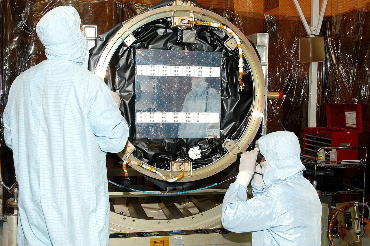 KENNEDY SPACE CENTER, FLA. -- -- In the Multi-Payload Processing Facility, NASA's Galaxy Evolution Explorer is prepared for mating with the Pegasus XL launch vehicle. The GALEX, set to launch April 2 from Cape Canaveral Air Force Station, will carry into space an orbiting telescope that will observe a million galaxies across 10 billion years of cosmic history to help astronomers determine when the stars and elements we see today had their origins. The spacecraft will sweep the skies for 28 months using state-of-the-art ultraviolet detectors to single out galaxies dominated by young, hot, short-lived stars that give off a great deal of energy at that wavelength.  These galaxies are actively creating stars, and therefore provide a window into the history and causes of star formation in galaxies.