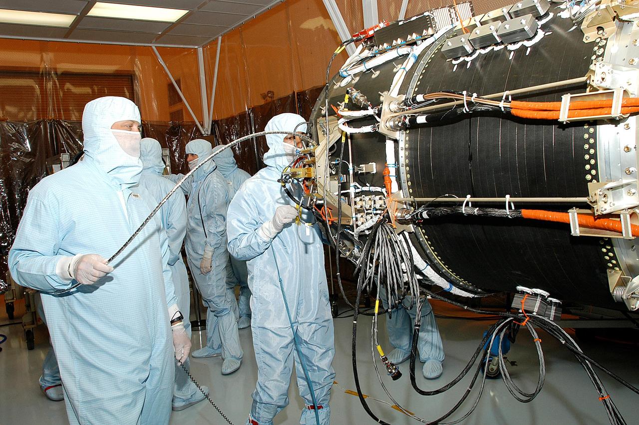 KENNEDY SPACE CENTER, FLA. -- In the Multi-Payload Processing Facility, NASA's Galaxy Evolution Explorer is prepared for mating with the Pegasus XL launch vehicle. The GALEX, set to launch April 2 from Cape Canaveral Air Force Station, will carry into space an orbiting telescope that will observe a million galaxies across 10 billion years of cosmic history to help astronomers determine when the stars and elements we see today had their origins. The spacecraft will sweep the skies for 28 months using state-of-the-art ultraviolet detectors to single out galaxies dominated by young, hot, short-lived stars that give off a great deal of energy at that wavelength.  These galaxies are actively creating stars, and therefore provide a window into the history and causes of star formation in galaxies.