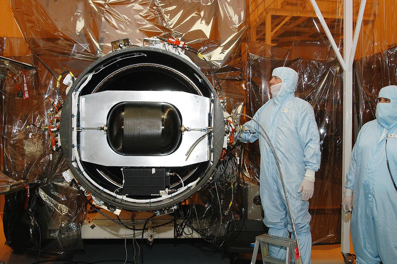 KENNEDY SPACE CENTER, FLA. -- In the Multi-Payload Processing Facility, NASA's Galaxy Evolution Explorer is prepared for mating with the Pegasus XL launch vehicle. The GALEX, set to launch April 2 from Cape Canaveral Air Force Station, will carry into space an orbiting telescope that will observe a million galaxies across 10 billion years of cosmic history to help astronomers determine when the stars and elements we see today had their origins. The spacecraft will sweep the skies for 28 months using state-of-the-art ultraviolet detectors to single out galaxies dominated by young, hot, short-lived stars that give off a great deal of energy at that wavelength.  These galaxies are actively creating stars, and therefore provide a window into the history and causes of star formation in galaxies.