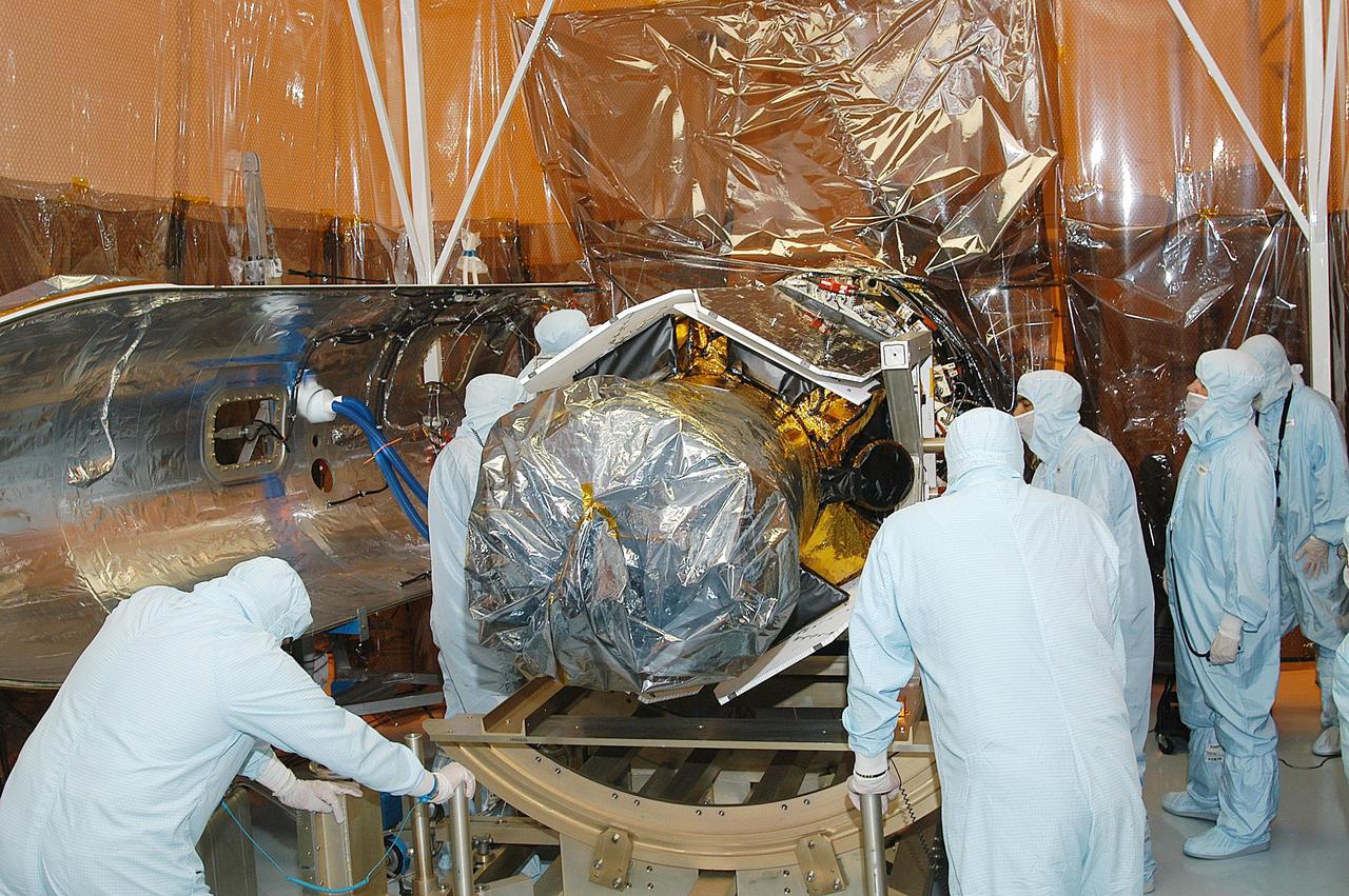 KENNEDY SPACE CENTER, FLA. -- In the Multi-Payload Processing Facility, NASA's Galaxy Evolution Explorer is prepared for mating with the Pegasus XL launch vehicle. The GALEX, set to launch April 2 from Cape Canaveral Air Force Station, will carry into space an orbiting telescope that will observe a million galaxies across 10 billion years of cosmic history to help astronomers determine when the stars and elements we see today had their origins. The spacecraft will sweep the skies for 28 months using state-of-the-art ultraviolet detectors to single out galaxies dominated by young, hot, short-lived stars that give off a great deal of energy at that wavelength.  These galaxies are actively creating stars, and therefore provide a window into the history and causes of star formation in galaxies.