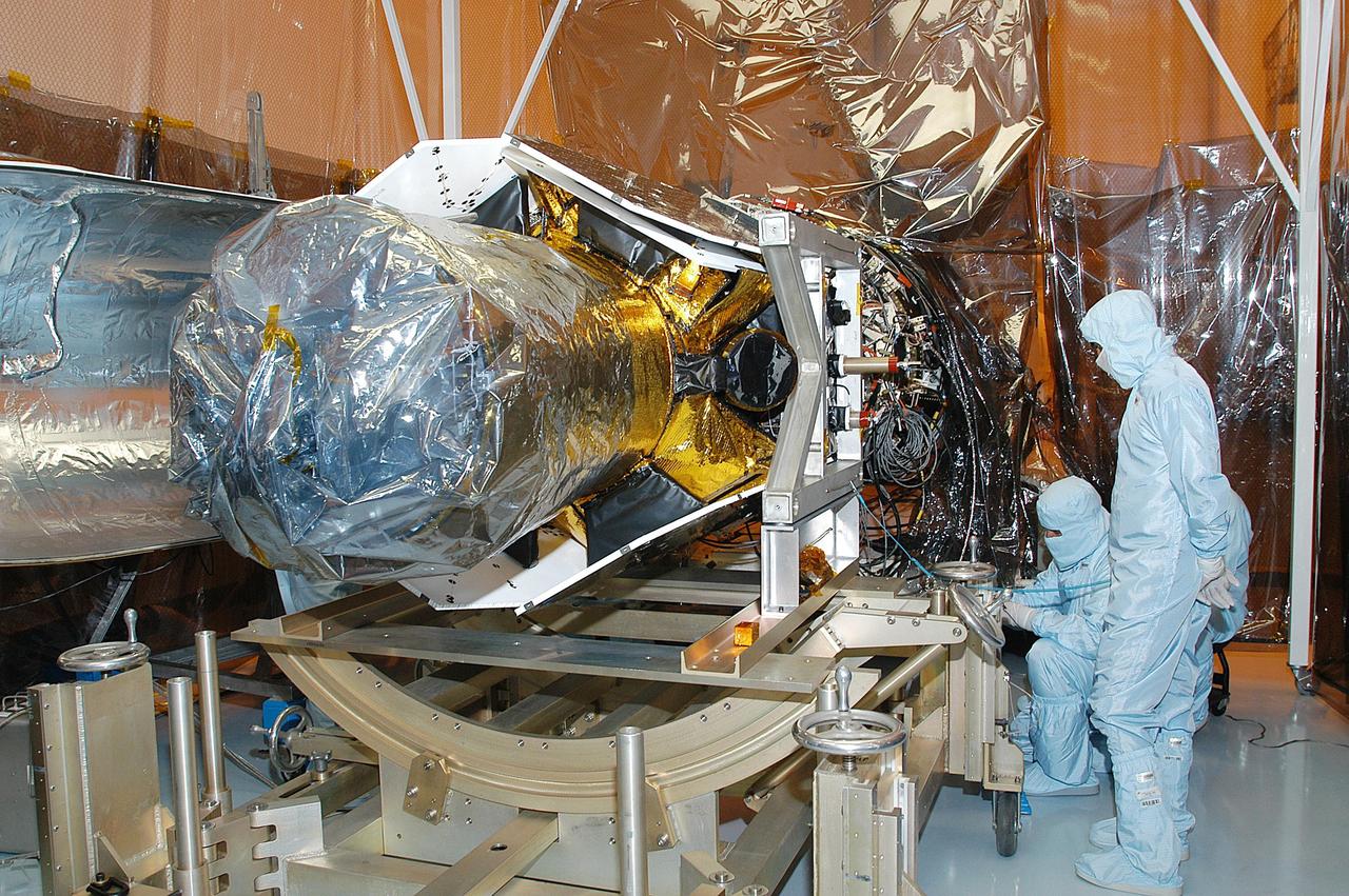 KENNEDY SPACE CENTER, FLA. -- In the Multi-Payload Processing Facility, NASA's Galaxy Evolution Explorer is prepared for mating with the Pegasus XL launch vehicle. The GALEX, set to launch April 2 from Cape Canaveral Air Force Station, will carry into space an orbiting telescope that will observe a million galaxies across 10 billion years of cosmic history to help astronomers determine when the stars and elements we see today had their origins. The spacecraft will sweep the skies for 28 months using state-of-the-art ultraviolet detectors to single out galaxies dominated by young, hot, short-lived stars that give off a great deal of energy at that wavelength.  These galaxies are actively creating stars, and therefore provide a window into the history and causes of star formation in galaxies.