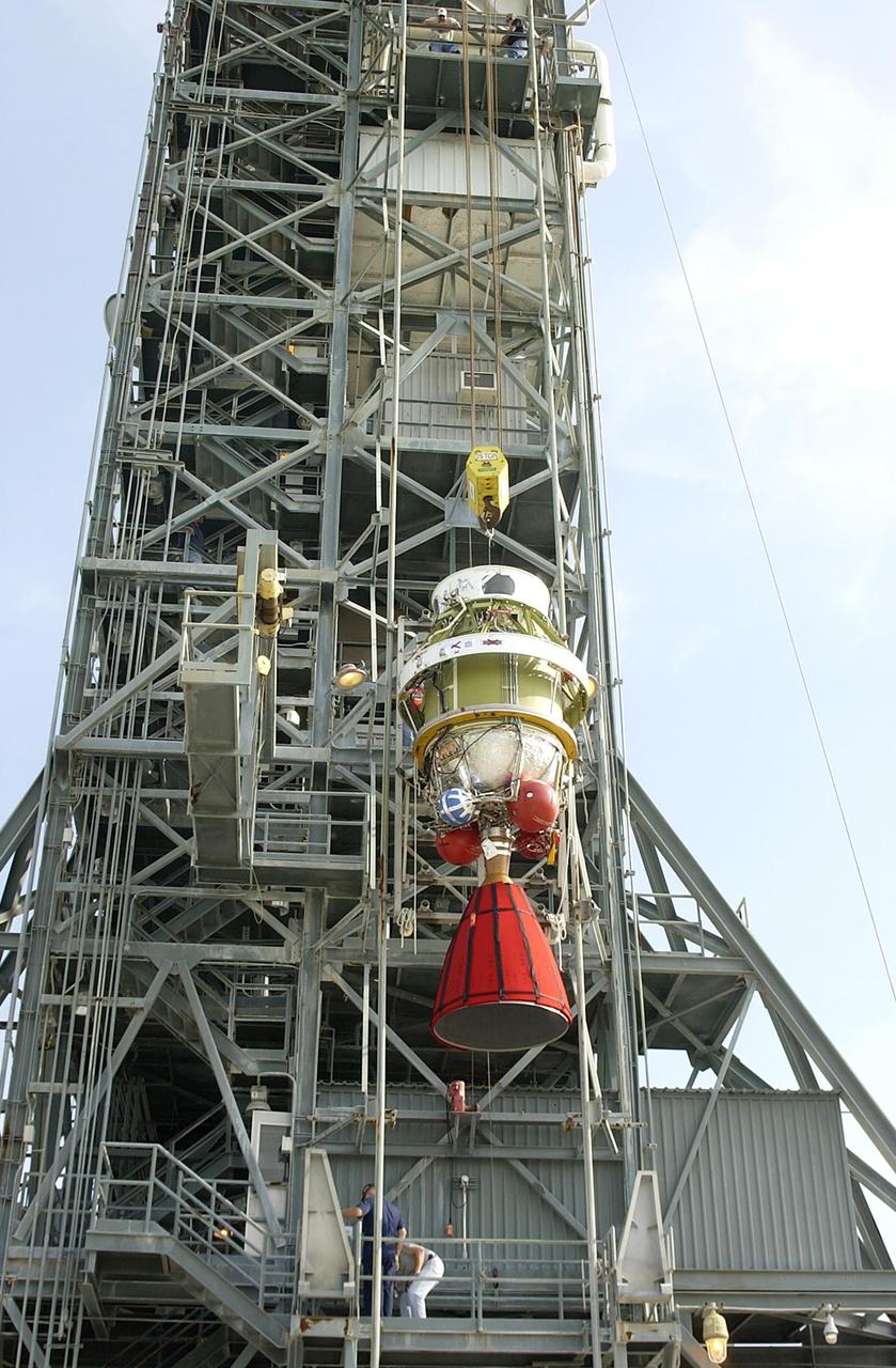 KENNEDY SPACE CENTER, FLA. -- The Boeing Delta II second stage is lifted up the tower on Launch Complex 17-B, Cape Canaveral Air Force Station.  It will be mated with the first stage, completing the erection of the launch vehicle for NASA's Space Infrared Telescope Facility. SIRTF will obtain images and spectra by detecting the infrared energy, or heat, radiated by objects in space. Most of this infrared radiation is blocked by the Earth's atmosphere and cannot be observed from the ground. Consisting of an 0.85-meter telescope and three cryogenically cooled science instruments, SIRTF is one of NASA's largest infrared telescopes to be launched.