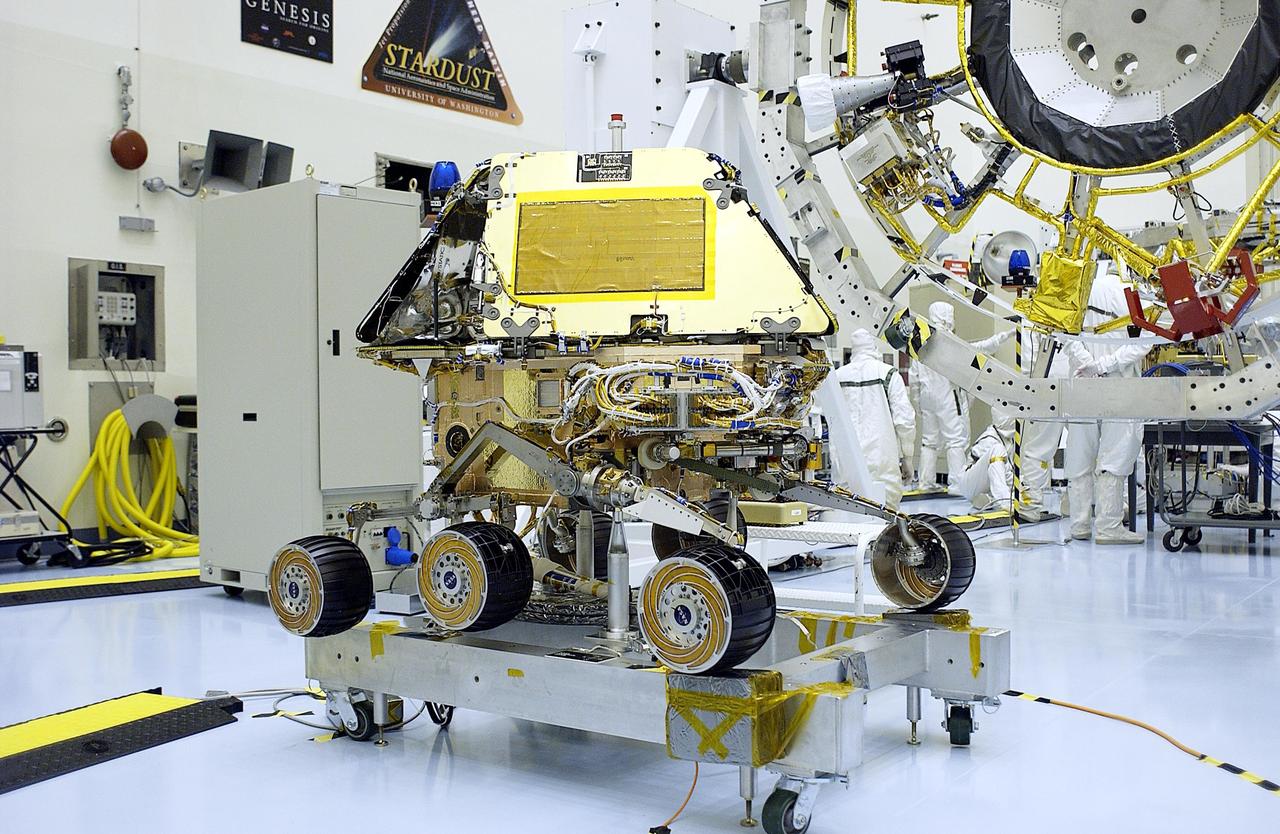 KENNEDY SPACE CENTER, FLA. - One of the Mars Exploration Rovers (MER) sits on a stand in the Payload Hazardous Servicing Facility.  Processing of the rovers, cruise stage, lander and heat shield elements is ongoing.  Set to launch in 2003, the MER Mission will consist of two identical rovers designed to cover roughly 110 yards each Martian day. Each rover will carry five scientific instruments that will allow it to search for evidence of liquid water that may have been present in the planet's past.  The rovers will be identical to each other, but will land at different regions of Mars.  The first rover has a launch window opening May 30, and the second rover a window opening June 25, 2003.