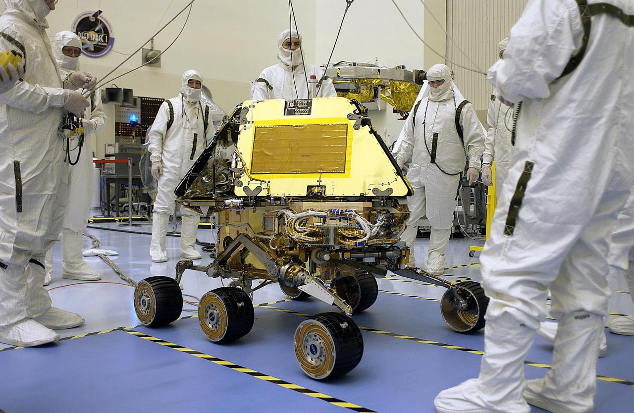 KENNEDY SPACE CENTER, Fla. -  With cables released, this Mars Exploration Rover sits on the floor of the Payload Hazardous Servicing Facility.  Processing of the rovers, cruise stage, lander and heat shield elements is ongoing.  Set to launch in 2003, the MER Mission will consist of two identical rovers designed to cover roughly 110 yards each Martian day. Each rover will carry five scientific instruments that will allow it to search for evidence of liquid water that may have been present in the planet's past.  The rovers will be identical to each other, but will land at different regions of Mars.  The first rover has a launch window opening May 30, and the second rover a window opening June 25, 2003.