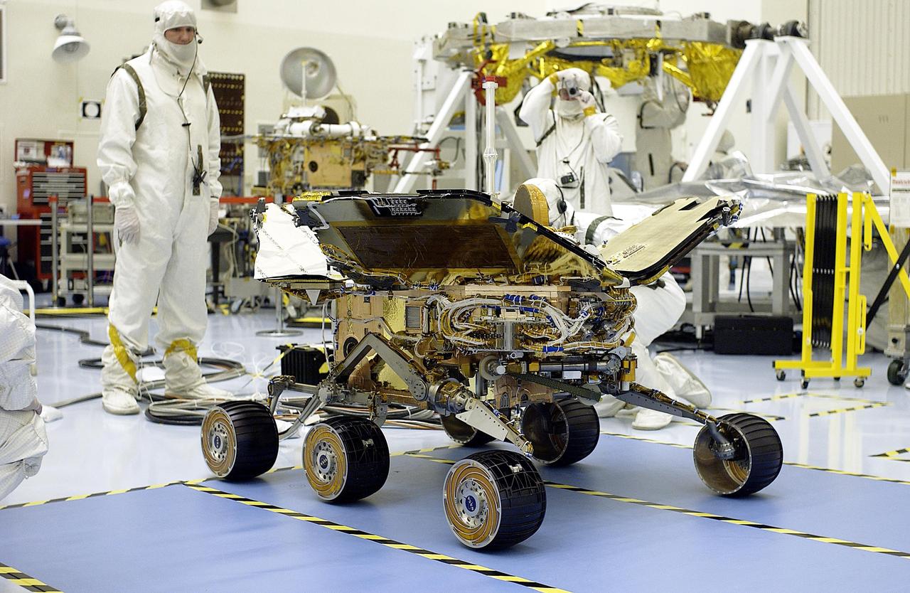 KENNEDY SPACE CENTER, Fla. -  Workers in the Payload Hazardous Servicing Facility test the opening of the solar arrays on the Mars Exploration Rover-2 (MER-2).  Set to launch in Spring 2003, the MER Mission will consist of two identical rovers designed to cover roughly 110 yards each Martian day. Each rover will carry five scientific instruments that will allow it to search for evidence of liquid water that may have been present in the planet's past.  The rovers will be identical to each other, but will land at different regions of Mars.  The first rover has a launch window opening May 30, and the second rover a window opening June 25, 2003.