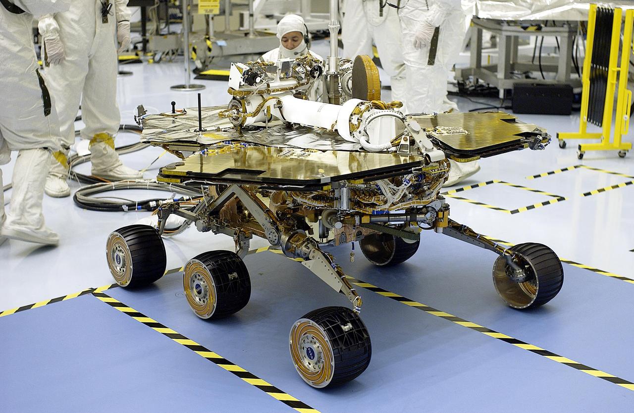 KENNEDY SPACE CENTER, Fla. -  The solar arrays on the Mars Exploration Rover-2 (MER-2) are fully opened during a test in the Payload Hazardous Servicing Facility.  Set to launch in Spring 2003, the MER Mission will consist of two identical rovers designed to cover roughly 110 yards each Martian day. Each rover will carry five scientific instruments that will allow it to search for evidence of liquid water that may have been present in the planet's past.  The rovers will be identical to each other, but will land at different regions of Mars.  The first rover has a launch window opening May 30, and the second rover a window opening June 25, 2003.