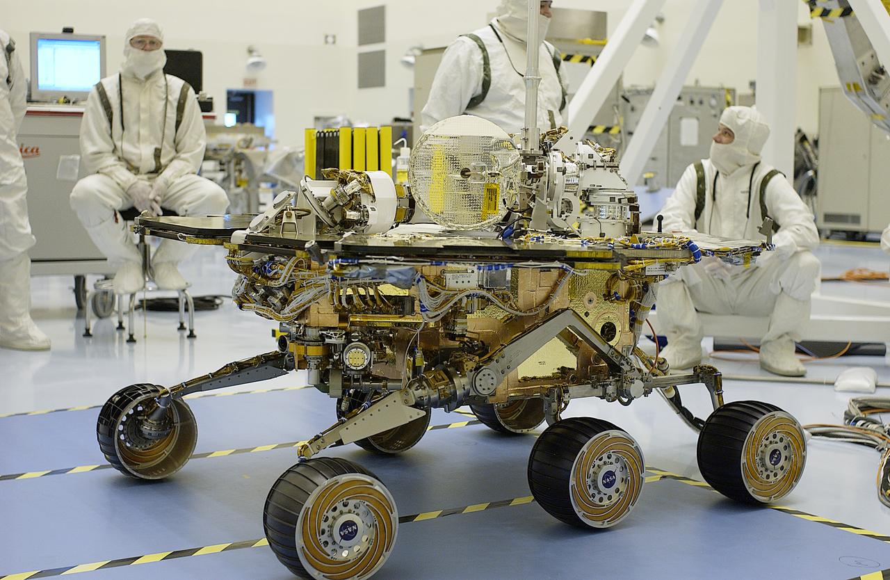 The solar arrays on the Mars Exploration Rover-2 (MER-2) are fully opened during a test in the Payload Hazardous Servicing Facility. Set to launch in Spring 2003, the MER Mission will consist of two identical rovers designed to cover roughly 110 yards each Martian day. Each rover will carry five scientific instruments that will allow it to search for evidence of liquid water that may have been present in the planet's past. The rovers will be identical to each other, but will land at different regions of Mars. The first rover has a launch window opening May 30, and the second rover a window opening June 25, 2003.