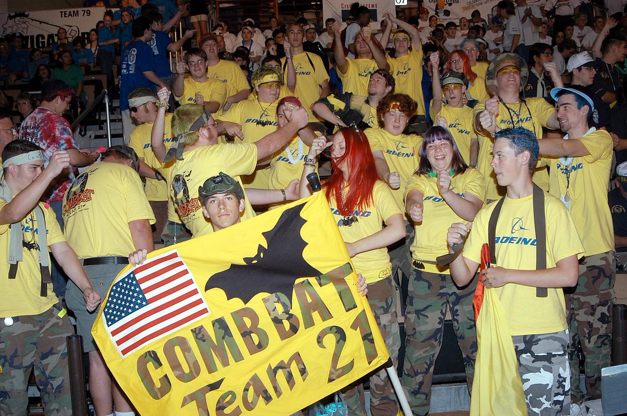 KENNEDY SPACE CENTER, FLA. -  The Boeing Company/Brevard Community College-sponsored students, participating in the 2003 Southeastern Regional FIRST Robotic Competition, demonstrate their team spirit. The competition is being held at the University of Central Florida (UCF) in Orlando, March 20-23. The team won the DaimlerChrysler Team Spirit Award and the Johnson & Johnson Sportsmanship Award. Forty teams from around the country are participating in the event that pits team-built gladiator robots against each other in an athletic-style competition. The teams are sponsored by NASA-Kennedy Space Center, The Boeing Company/Brevard Community College, and Lockheed Martin Space Operations/Mission Systems for the nonprofit organization For Inspiration and Recognition of Science and Technology, known as FIRST. The vision of FIRST is to inspire in the youth of our nation an appreciation of science and technology and an understanding that mastering these disciplines can enrich the lives of all mankind.