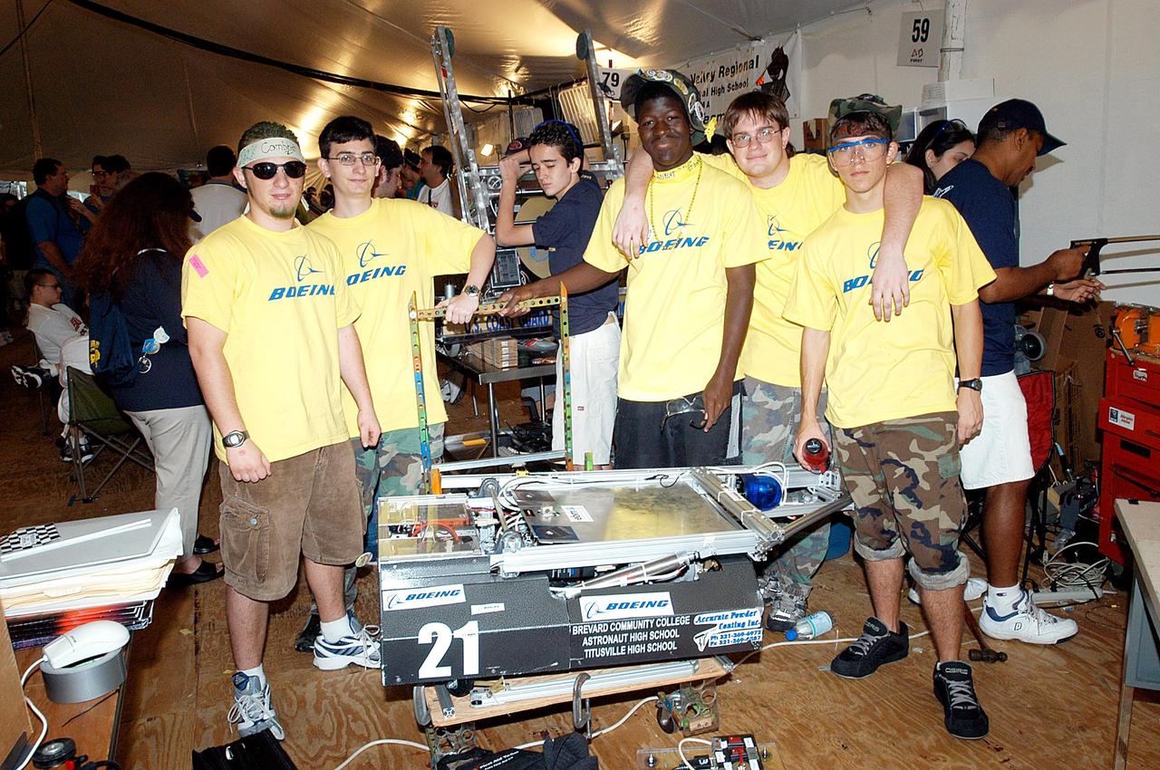 KENNEDY SPACE CENTER, FLA. -  The Boeing Company/Brevard Community College-sponsored students, participating in the 2003 Southeastern Regional FIRST Robotic Competition, pose with their team-built robot. The competition is being held at the University of Central Florida (UCF) in Orlando, March 20-23. Forty teams from around the country are participating in the event that pits team-built gladiator robots against each other in an athletic-style competition. The teams are sponsored by NASA-Kennedy Space Center, The Boeing Company/Brevard Community College, and Lockheed Martin Space Operations/Mission Systems for the nonprofit organization For Inspiration and Recognition of Science and Technology, known as FIRST. The vision of FIRST is to inspire in the youth of our nation an appreciation of science and technology and an understanding that mastering these disciplines can enrich the lives of all mankind.