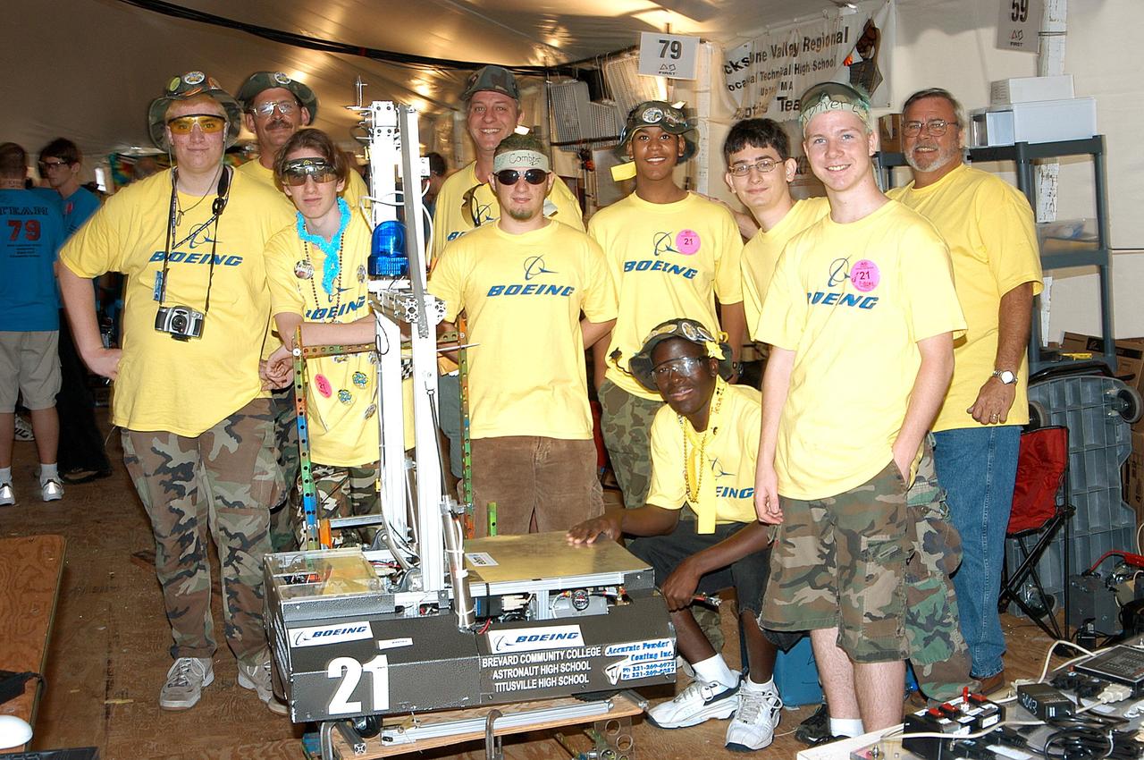 KENNEDY SPACE CENTER, FLA. -  The Boeing Company/Brevard Community College-sponsored students, participating in the 2003 Southeastern Regional FIRST Robotic Competition, pose with their team-built robot. The competition is being held at the University of Central Florida (UCF) in Orlando, March 20-23. Forty teams from around the country are participating in the event that pits team-built gladiator robots against each other in an athletic-style competition. The teams are sponsored by NASA/Kennedy Space Center, The Boeing Company/Brevard Community College, and Lockheed Martin Space Operations/Mission Systems for the nonprofit organization For Inspiration and Recognition of Science and Technology, known as FIRST. The vision of FIRST is to inspire in the youth of our nation an appreciation of science and technology and an understanding that mastering these disciplines can enrich the lives of all mankind.