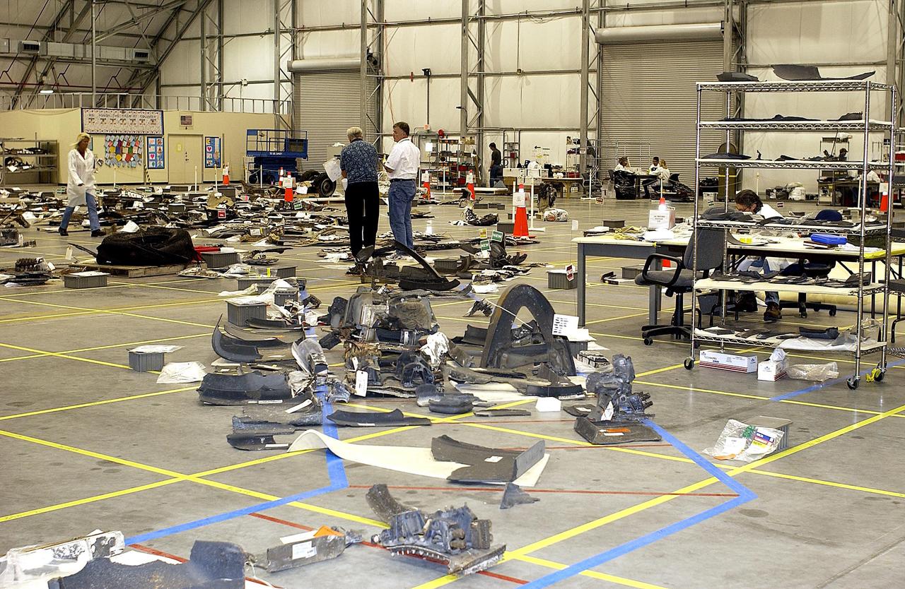KENNEDY SPACE CENTER, FLA. - Columbia debris is filling the floor of the KSC RLV Hangar.  The Columbia Reconstruction Project team is identifying pieces and placing them on a grid approximating the shape of the orbiter.  About 25 percent of the orbiter has been delivered to the hangar.