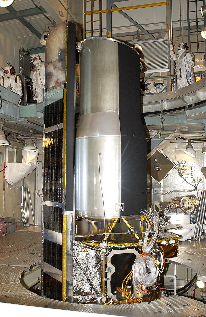 In the launch tower on Launch Complex 17-B, Cape Canaveral Air Force Station, the Space Infrared Telescope Facility (SIRTF) is ready for encapsulation. A fairing will be installed around the spacecraft to protect it during launch. SIRTF will obtain images and spectra by detecting the infrared energy, or heat, radiated by objects in space. Most of this infrared radiation is blocked by the Earth's atmosphere and cannot be observed from the ground. Consisting of an 0.85-meter telescope and three cryogenically cooled science instruments, SIRTF is one of NASA's largest infrared telescopes to be launched. SIRTF is currently scheduled for launch April 18 aboard a Delta II rocket from Launch Complex 17-B, Cape Canaveral Air Force Station.