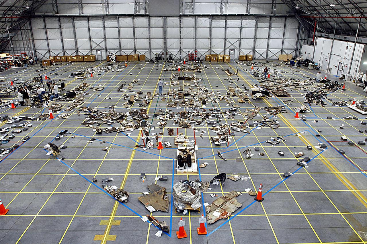 KENNEDY SPACE CENTER, FLA. -- A wide-angle view of the RLV Hangar at KSC shows a portion of the more than 75,000 pieces of Columbia debris that have been shipped to KSC. More than 2,000 pieces have been placed on the grid on the RLV Hangar floor. To date, about 35 percent of Columbia, by weight, has been delivered to the hangar.  Approximately 40 percent is expected to be recovered.