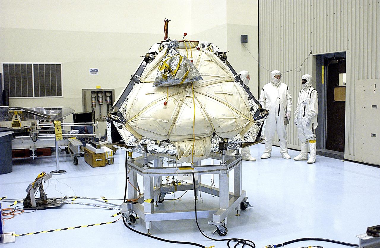 KENNEDY SPACE CENTER, FLA. -- In the Payload Hazardous Servicing Facility, preparations are under way to reopen the lander petals of the Mars Exploration Rover 2 (MER-2) to allow technicians access to one of the spacecraft's circuit boards.  A concern arose during prelaunch testing regarding how the spacecraft interprets signals sent from its main computer to peripherals in the cruise stage, lander and small deep space transponder.  The MER Mission consists of two identical rovers set to launch in June 2003. The problem will be fixed on both rovers.
