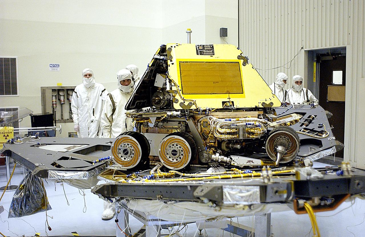 KENNEDY SPACE CENTER, FLA. -- In the Payload Hazardous Servicing Facility, the lander petals of the Mars Exploration Rover 2 (MER-2) have been reopened to allow technicians access to one of the spacecraft's circuit boards.  A concern arose during prelaunch testing regarding how the spacecraft interprets signals sent from its main computer to peripherals in the cruise stage, lander and small deep space transponder.  The MER Mission consists of two identical rovers set to launch in June 2003. The problem will be fixed on both rovers.